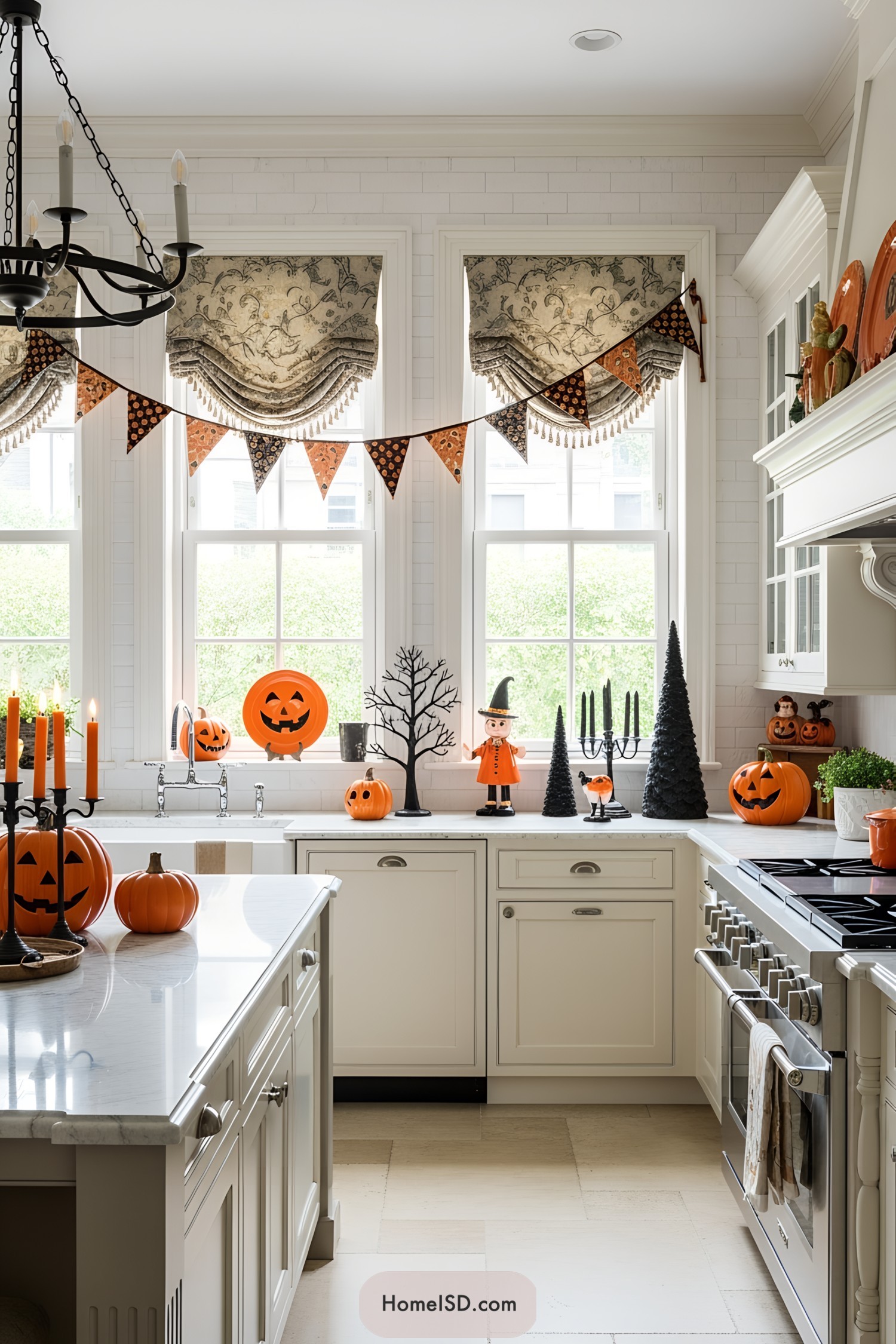 Kitchen with Halloween-themed decor including pumpkins and banners