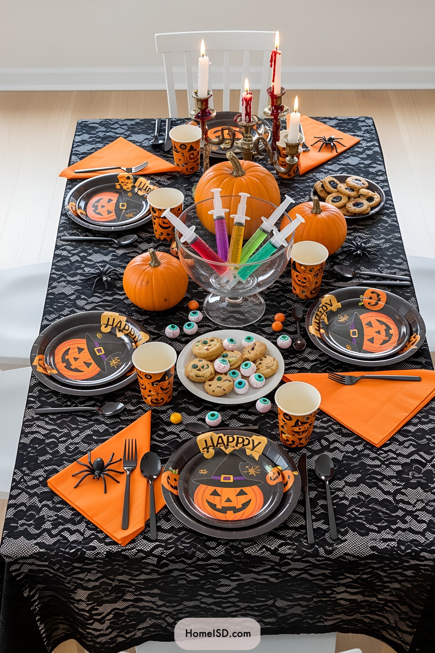 A Halloween-themed table setting with pumpkins and playful décor