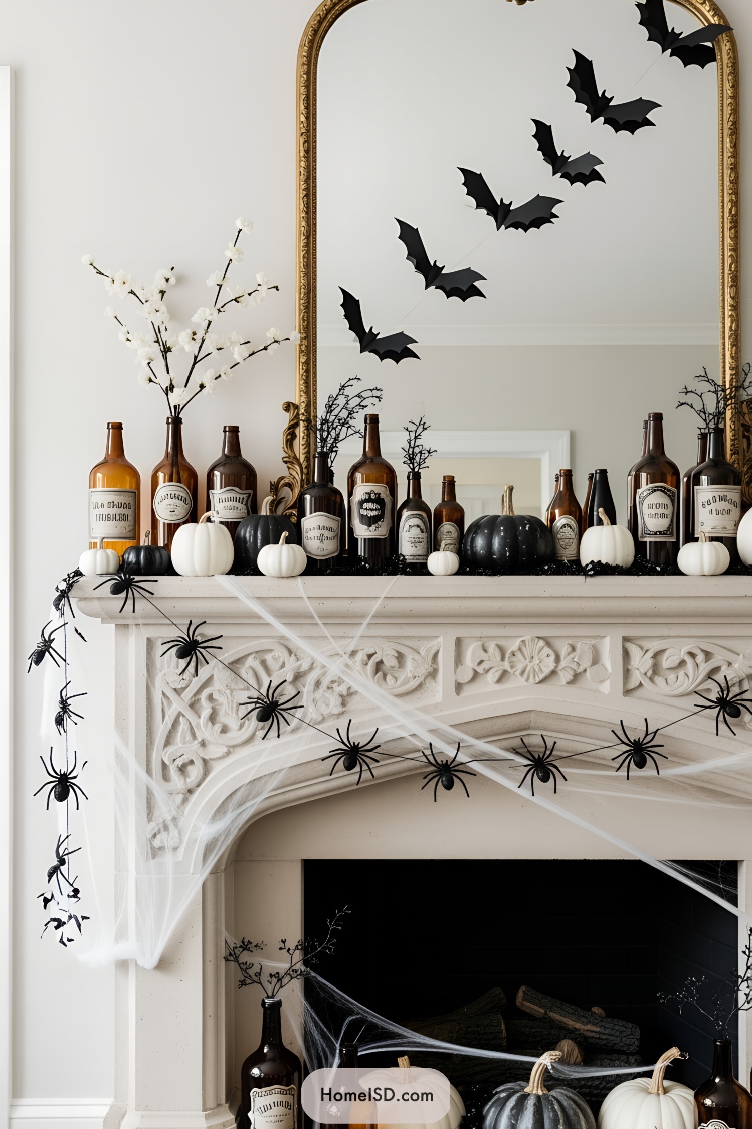 Halloween-themed fireplace mantle with potion bottles, bats, and cobwebs