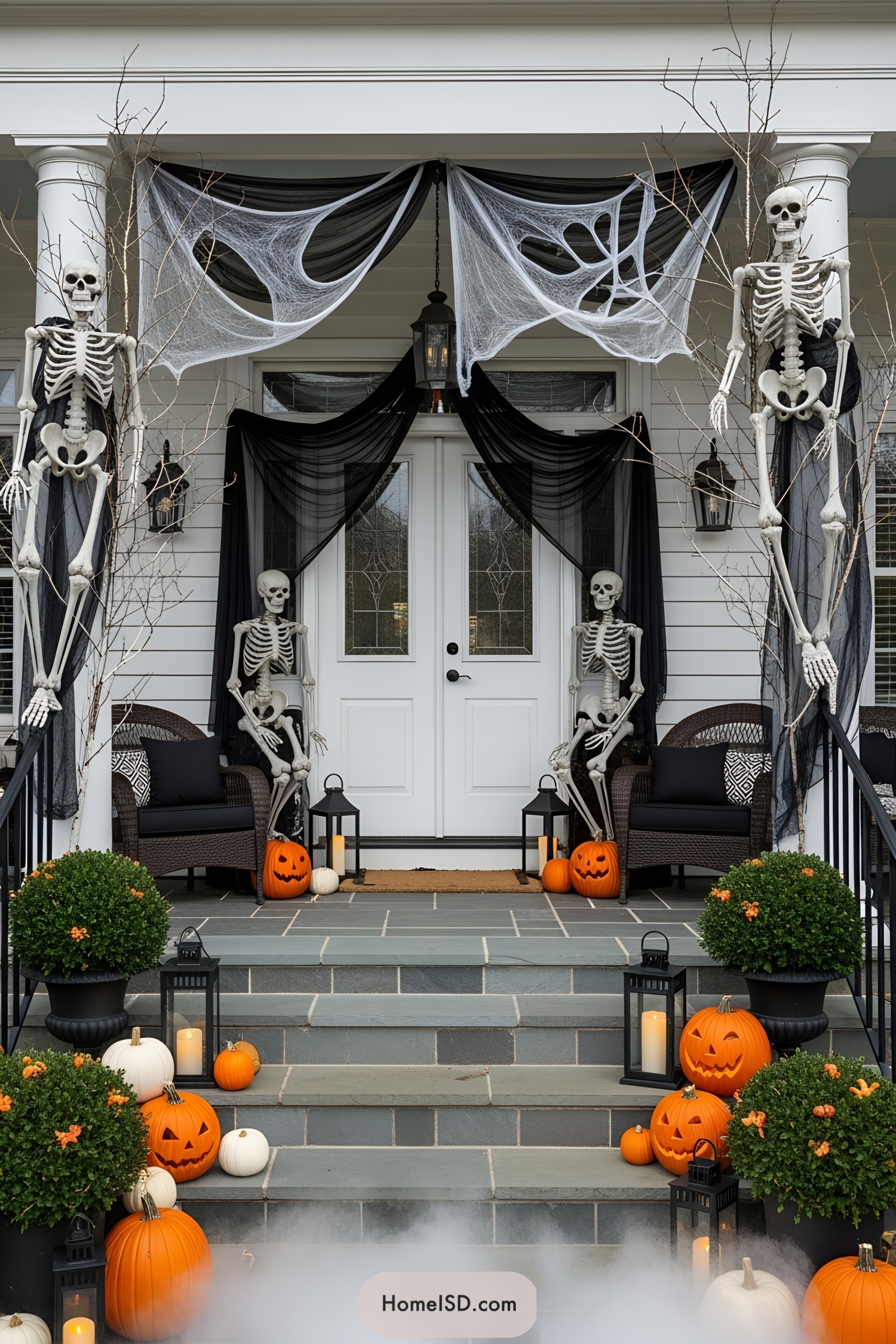 Halloween porch with skeletons and pumpkins
