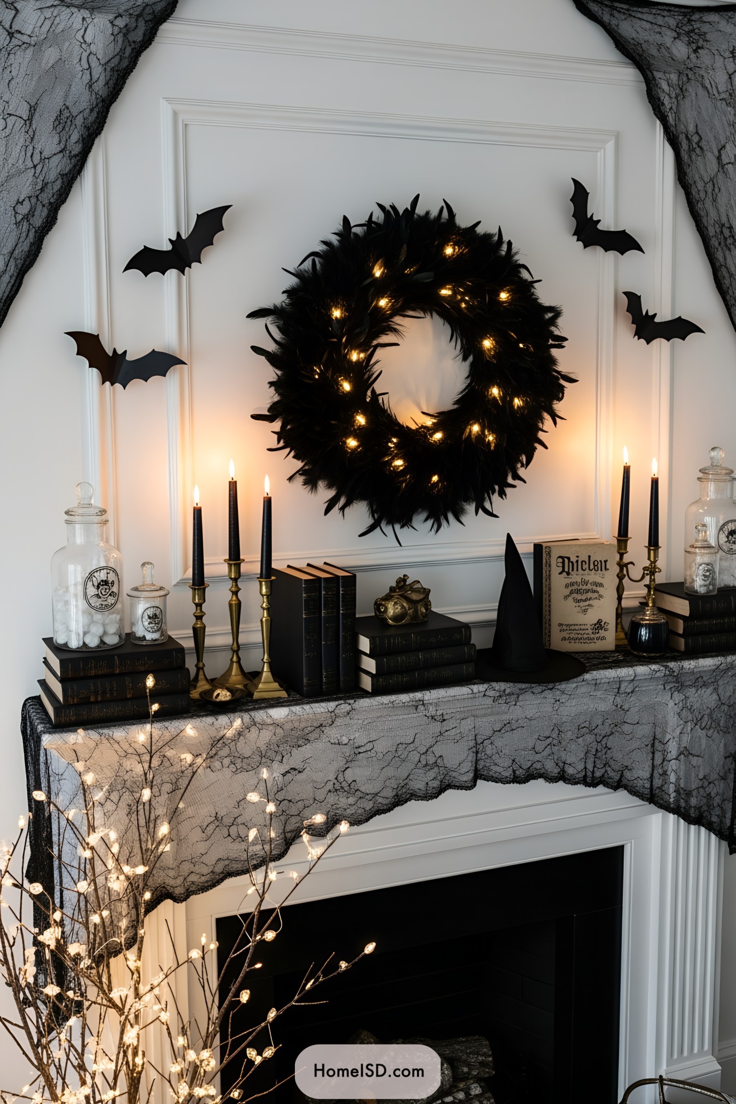 Spooky mantel with black wreath and bats