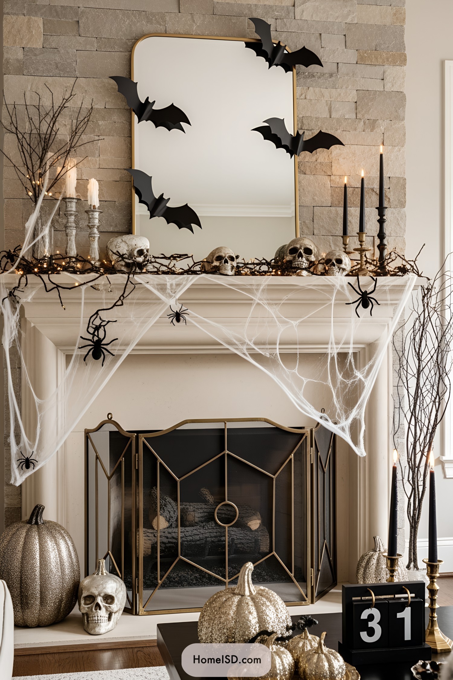 A stylish Halloween-themed mantel with skulls, bats, and cobwebs