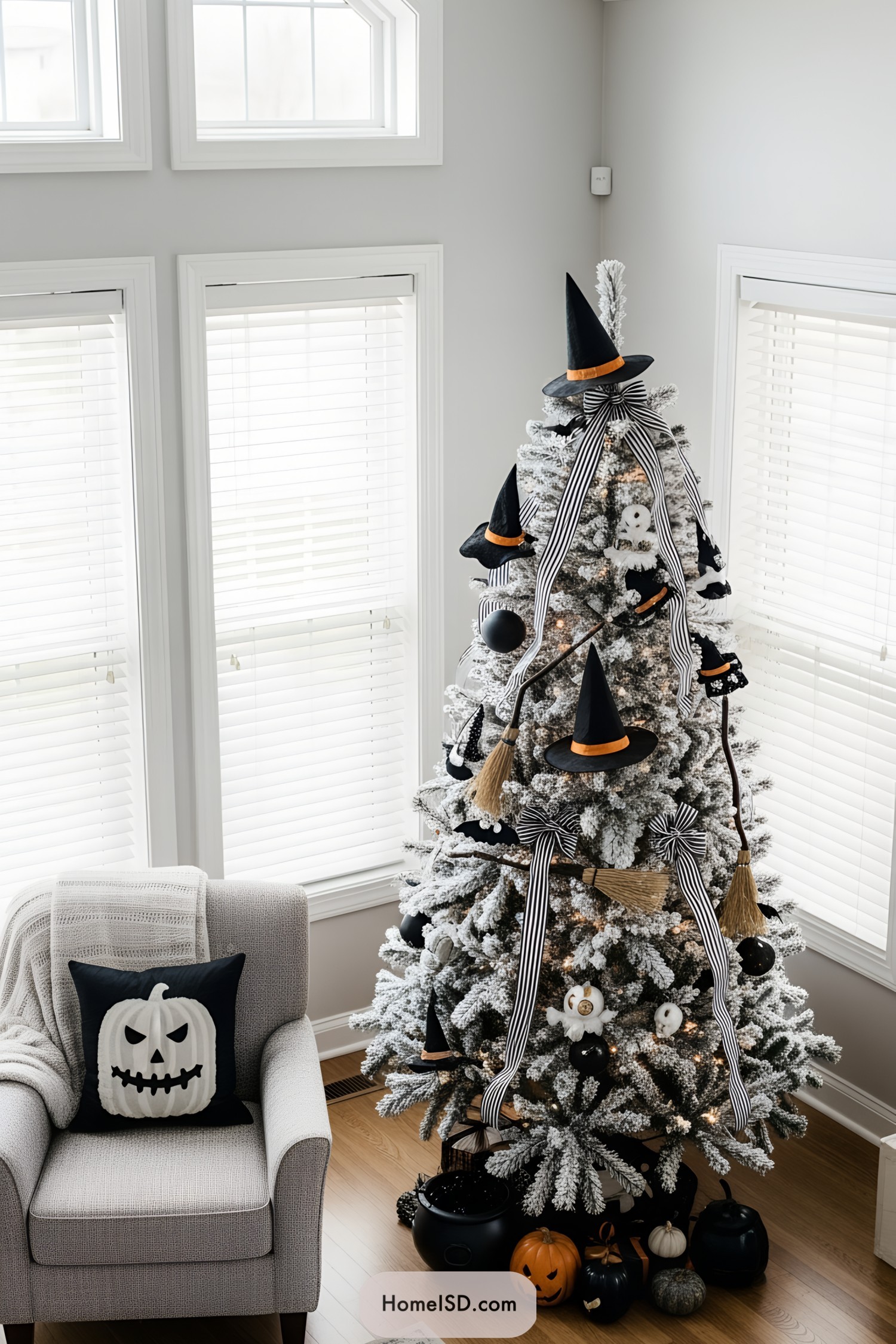 Frosted Halloween tree adorned with witch hats and striped ribbons