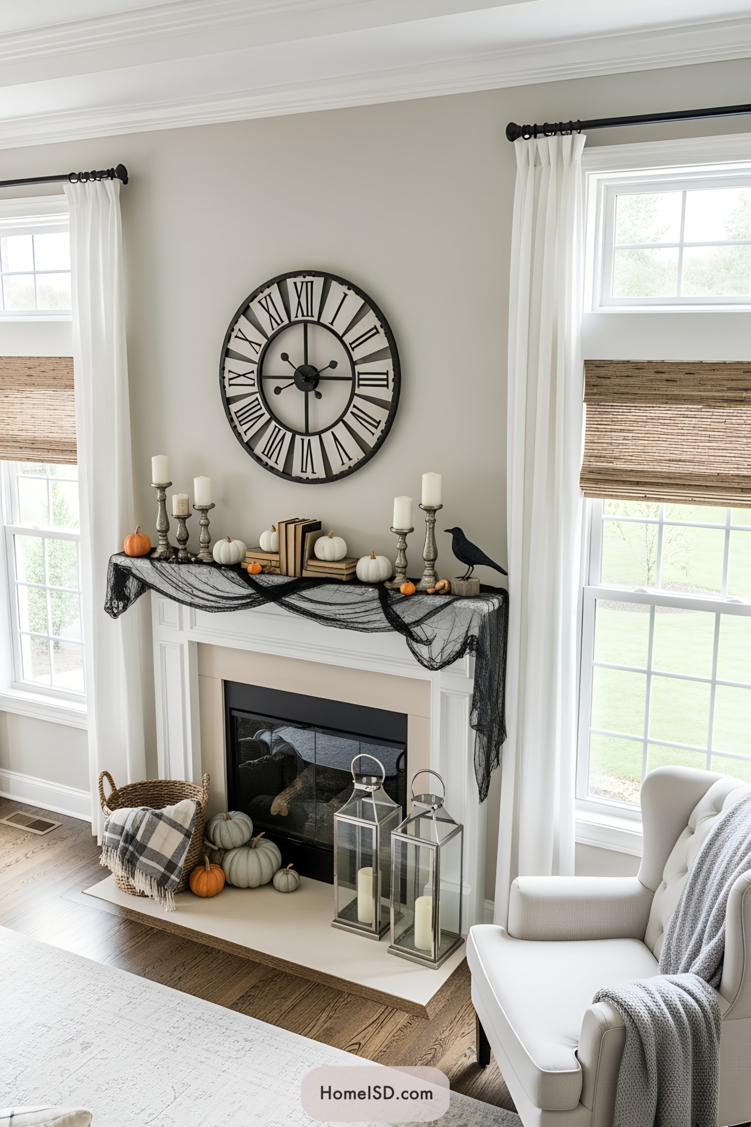 Elegant Halloween mantle with pumpkins and candles