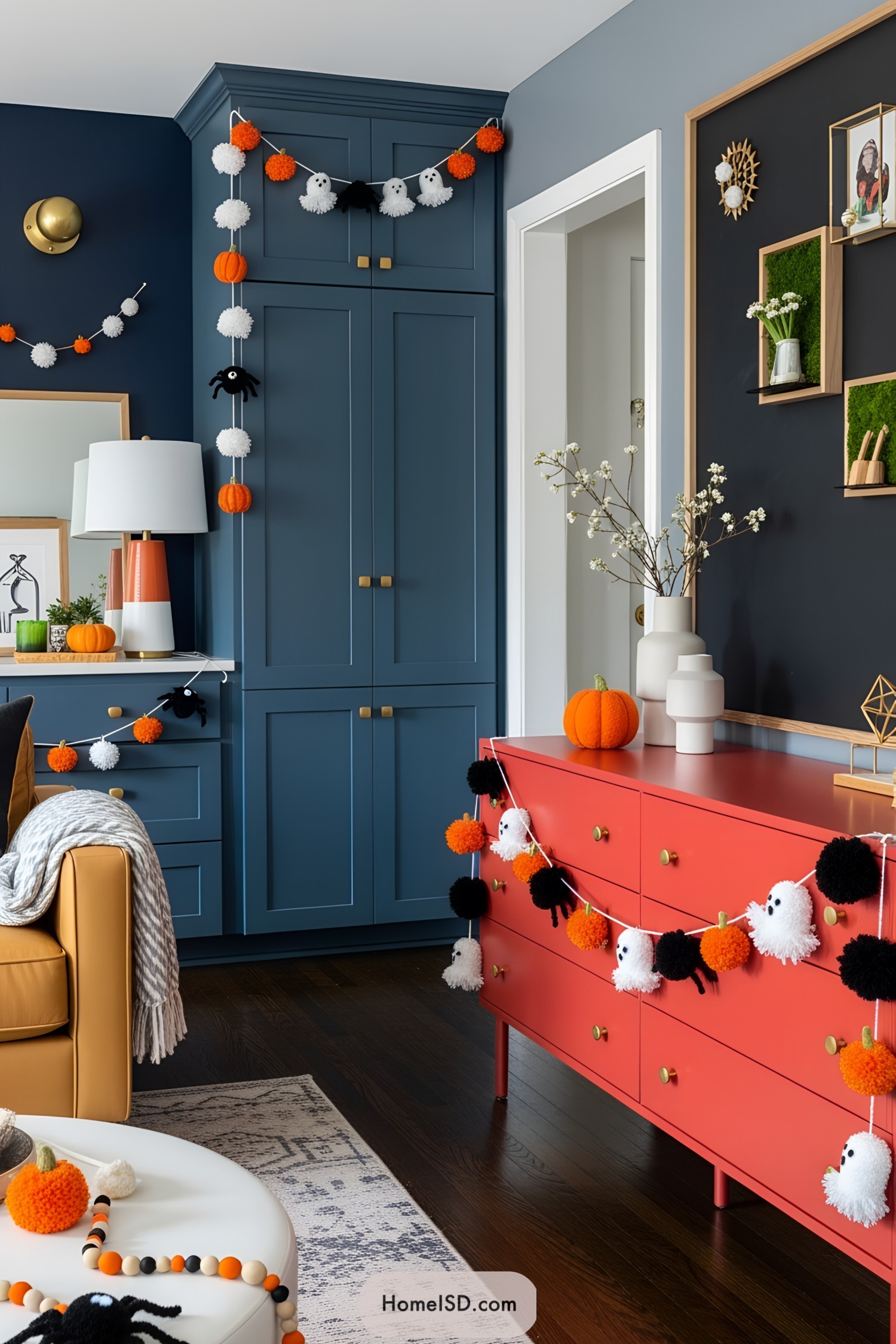 Colorful pom-pom garlands with pumpkins and ghosts