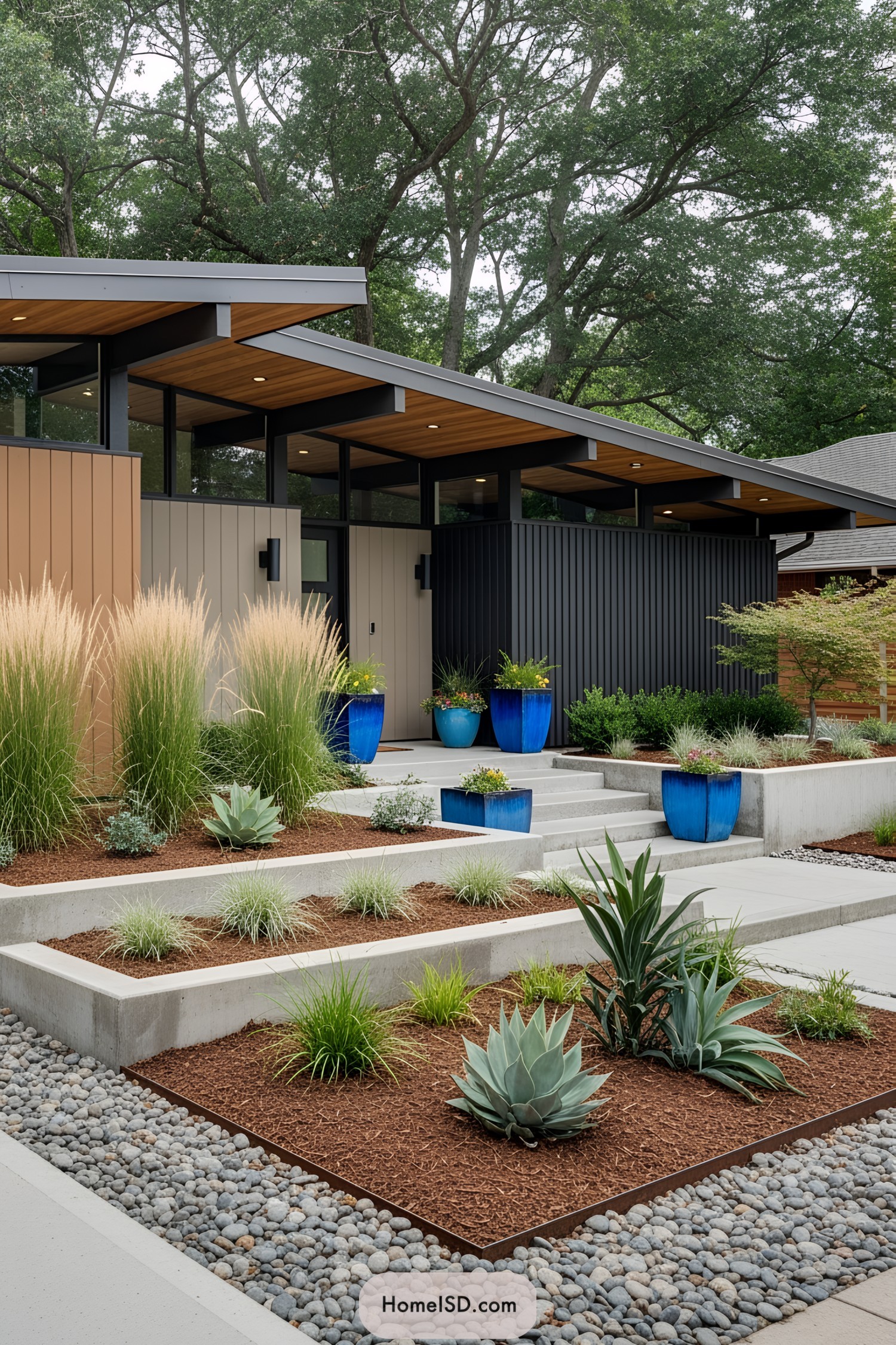 Modern front yard with blue pots and sleek design