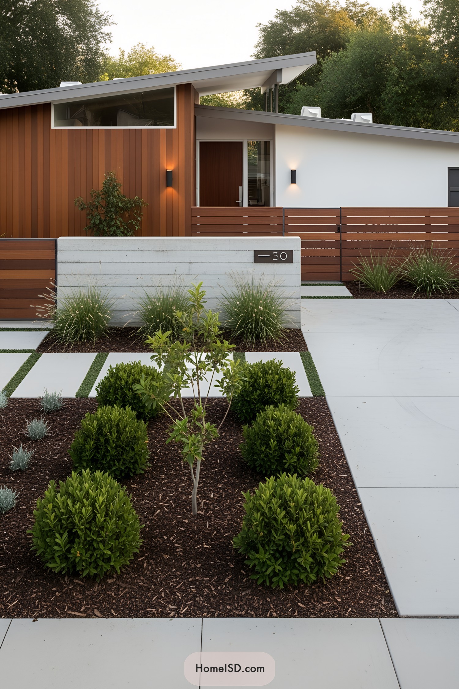Minimalist house with wooden accents, modern concrete elements, and lush greenery