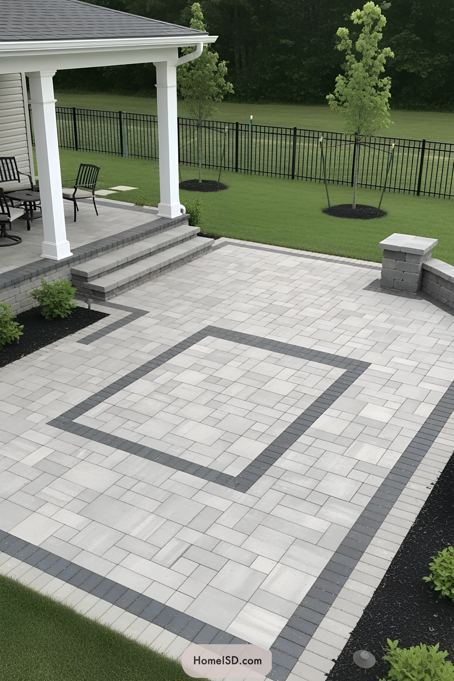 Modern paver patio with steps and greenery