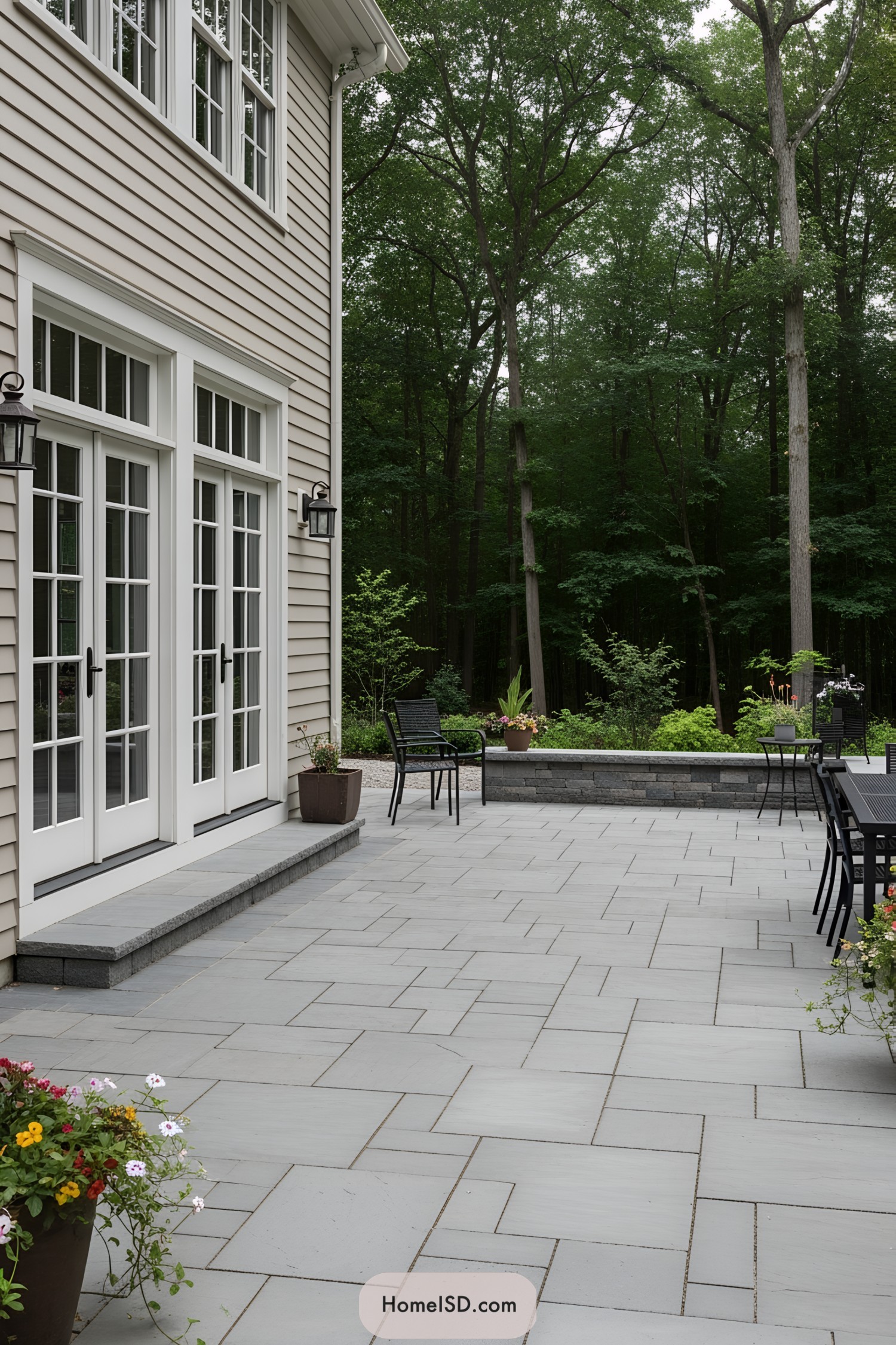 Stylish patio with sleek pavers and lush surroundings