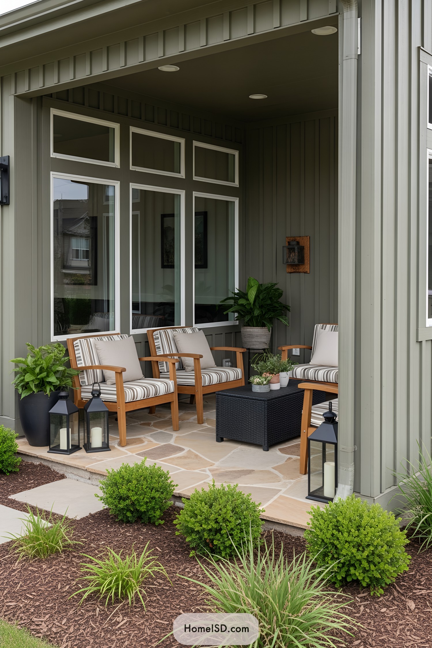 Cozy patio with wooden chairs and lush plants