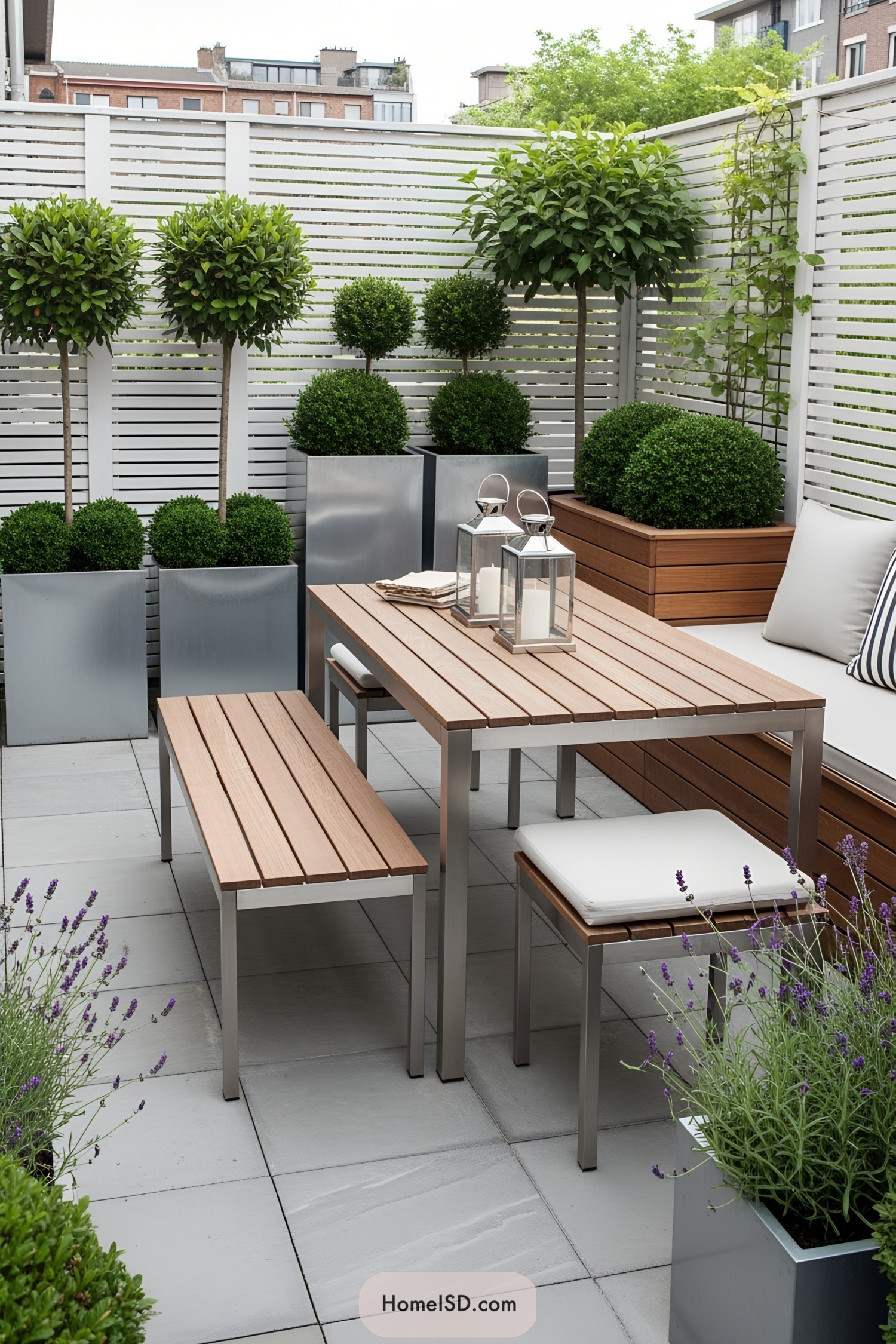 Small patio with modern furniture and lush greenery