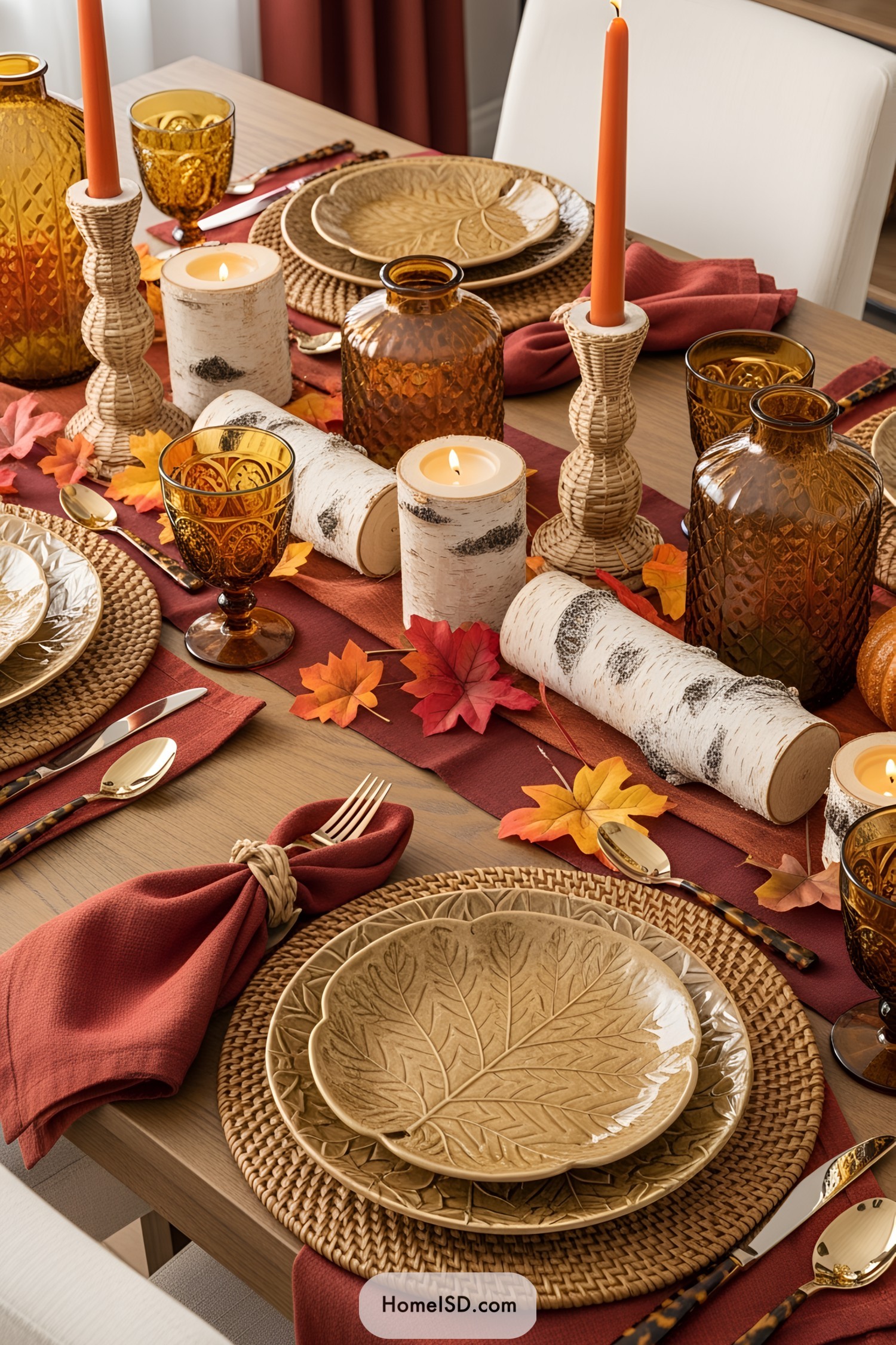 Rustic table setting with autumn leaves and candles