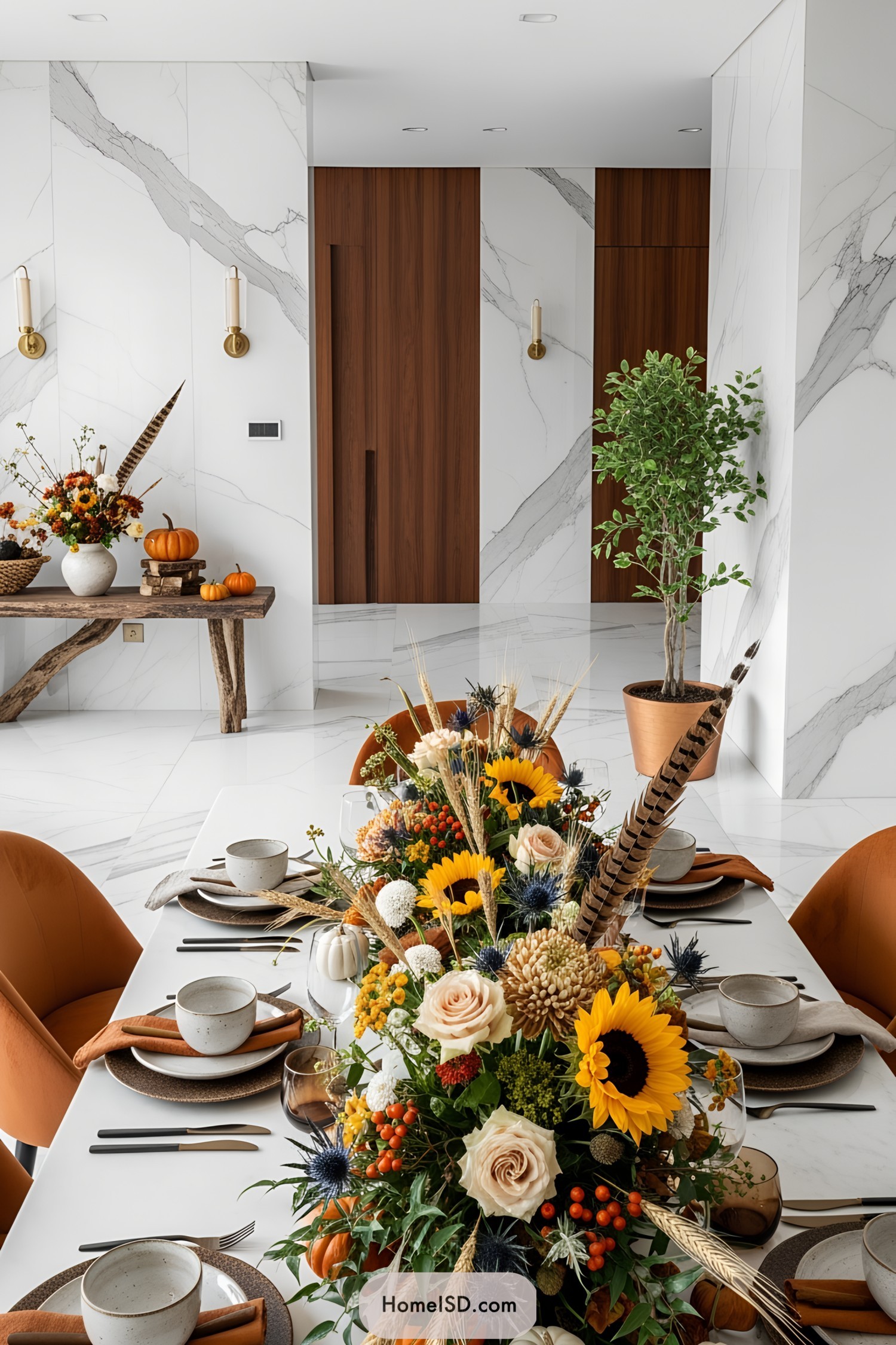 Festive Thanksgiving table setting with vibrant flowers and pumpkins