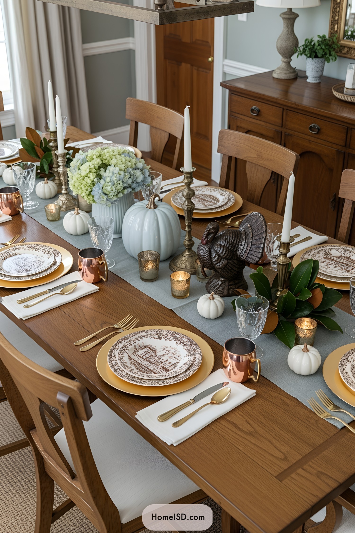 Inviting Thanksgiving table setting with pumpkins and candles