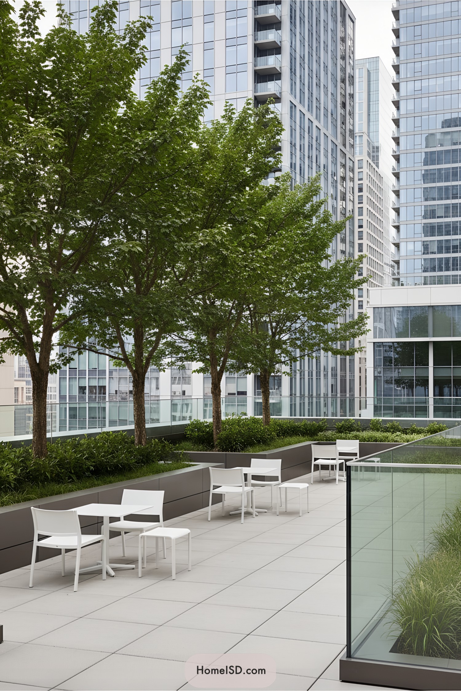 Urban terrace with trees, modern seating, and skyscraper backdrop
