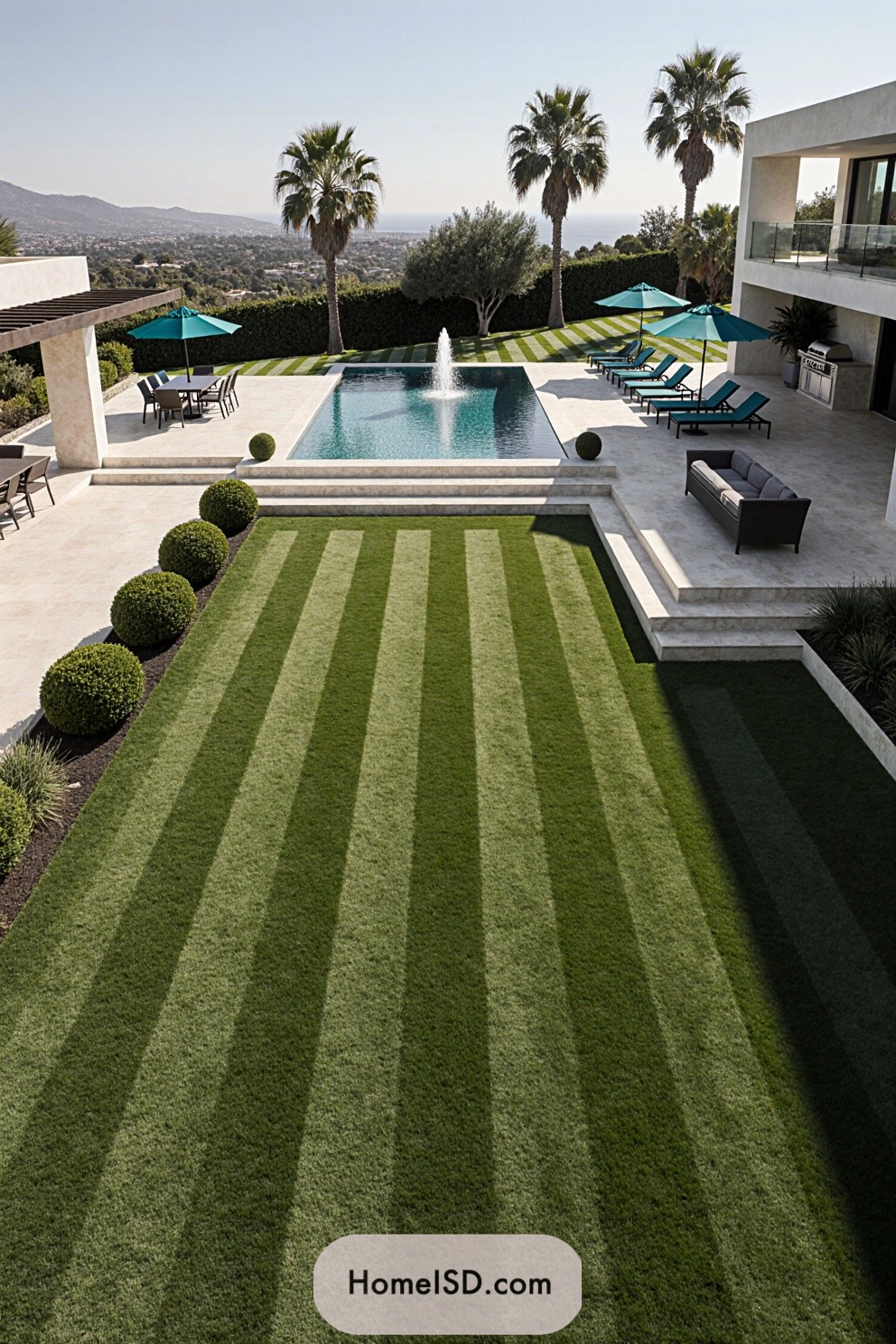 Outdoor villa landscape with pool, striped lawn, and palm trees