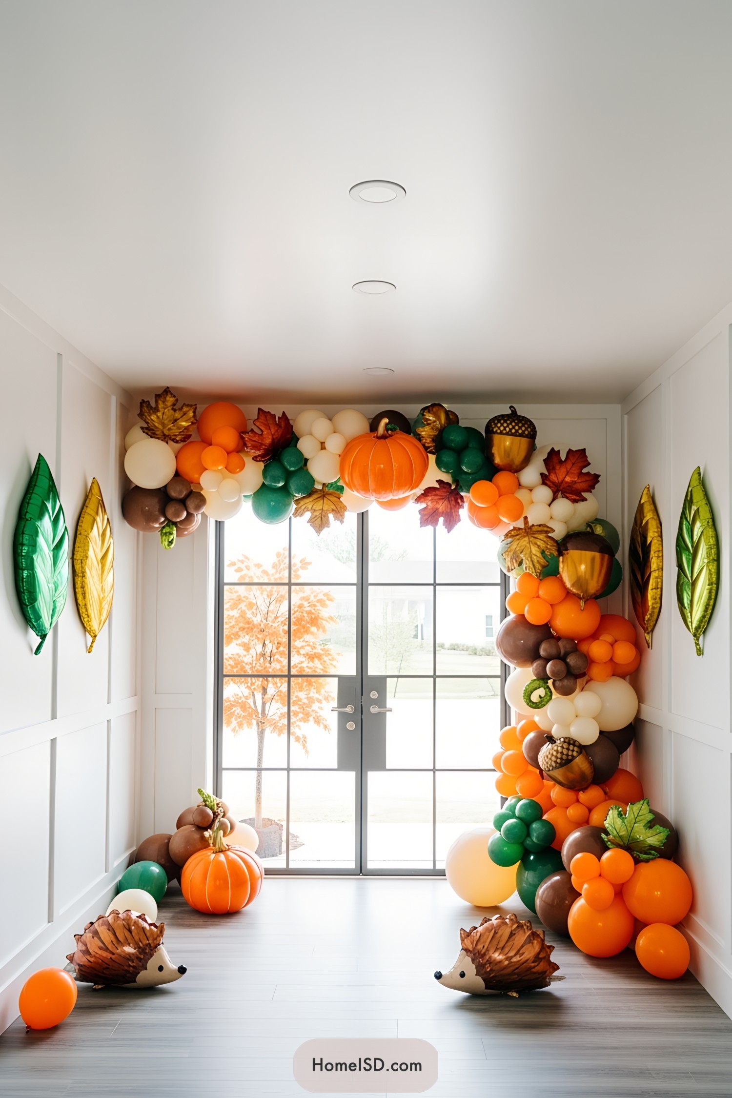 Colorful balloon arch with autumn accents