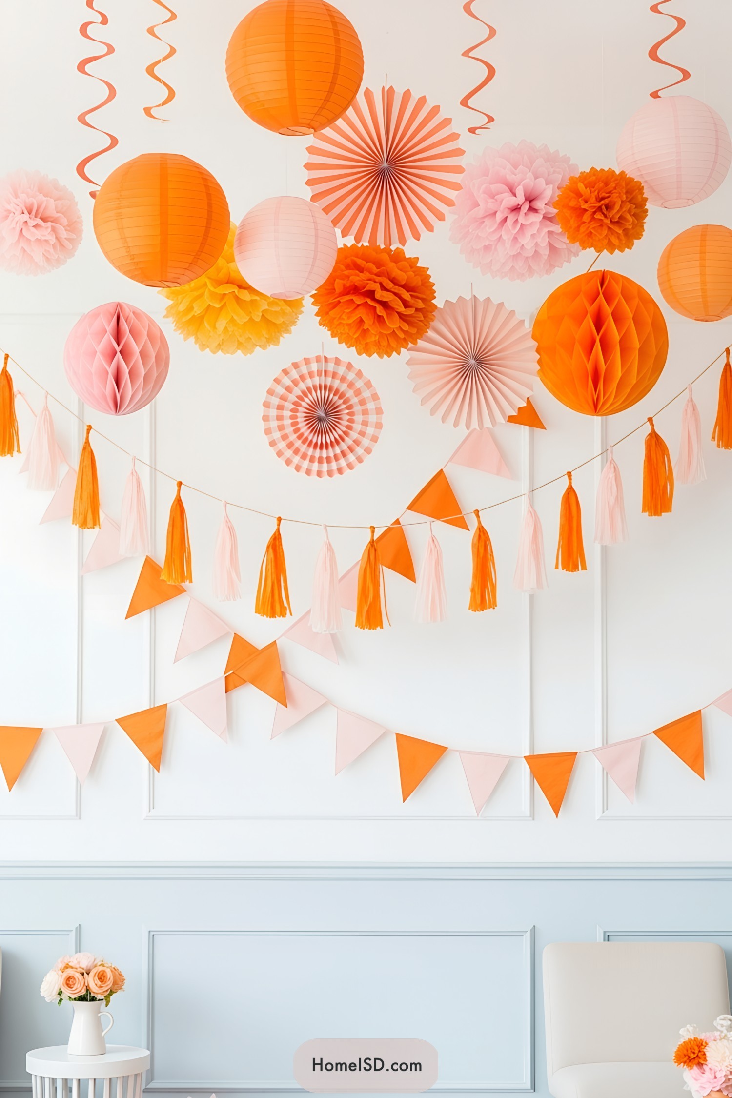 Festive orange and pink decorations hanging indoors