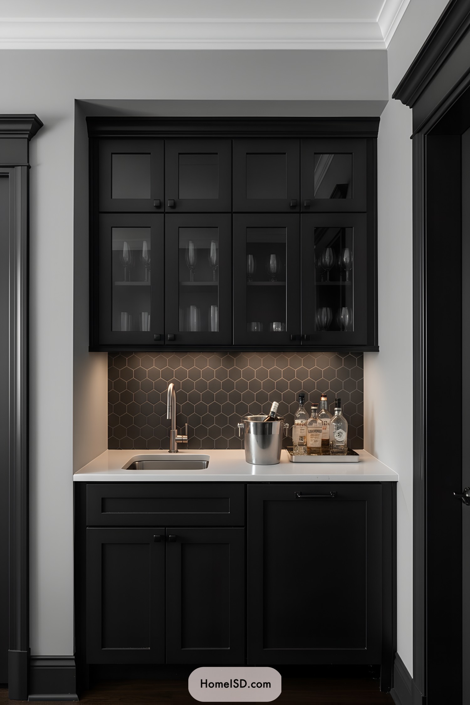 Small wet bar with black cabinets, hex backsplash, and white countertop