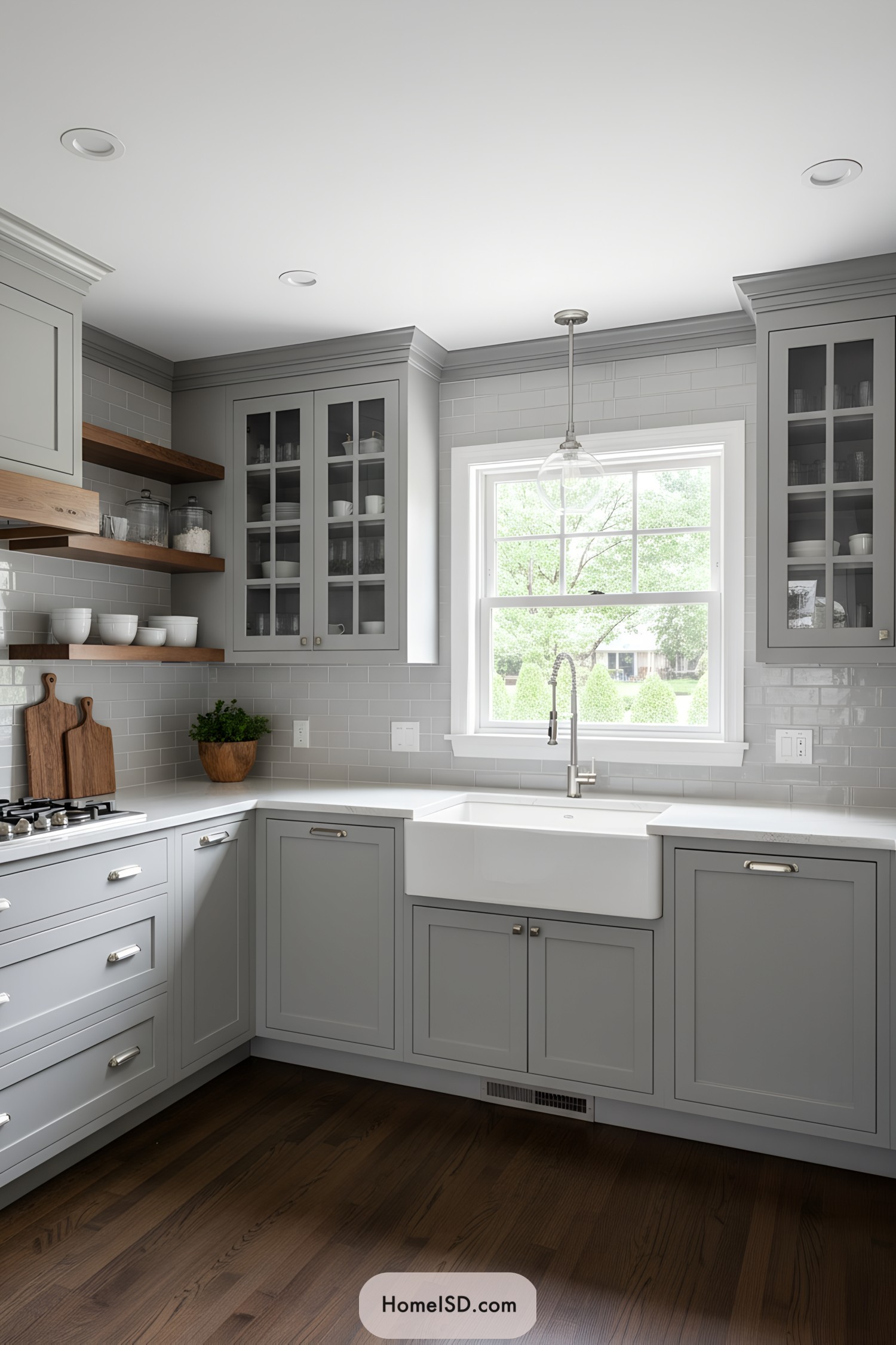 Light gray shaker kitchen with farmhouse sink and wood shelves