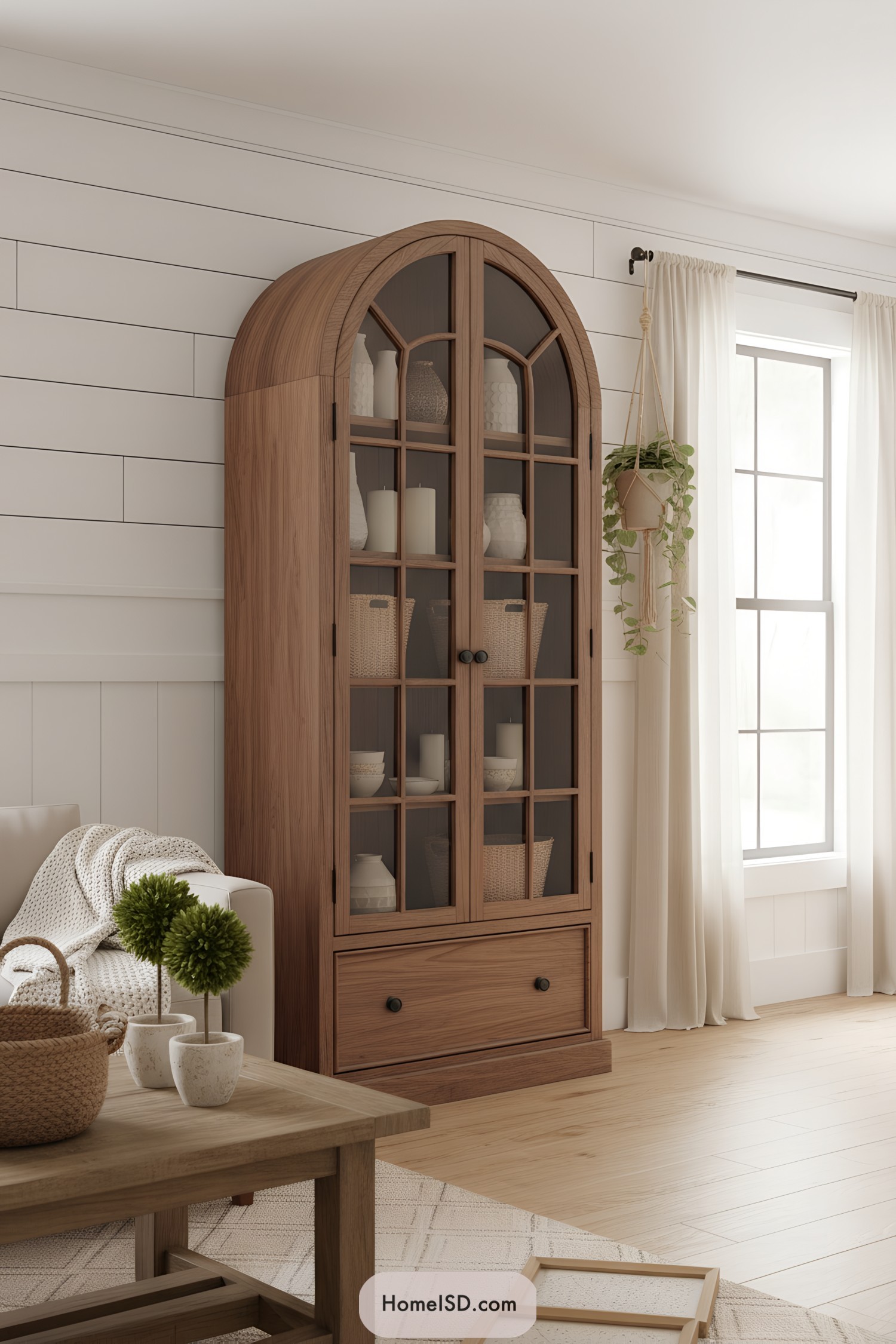 Arched glass-front oak cabinet with drawer