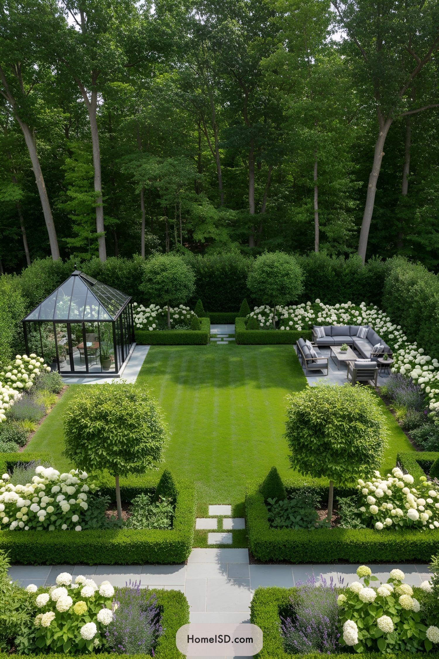 Lush garden with patio furniture and a greenhouse