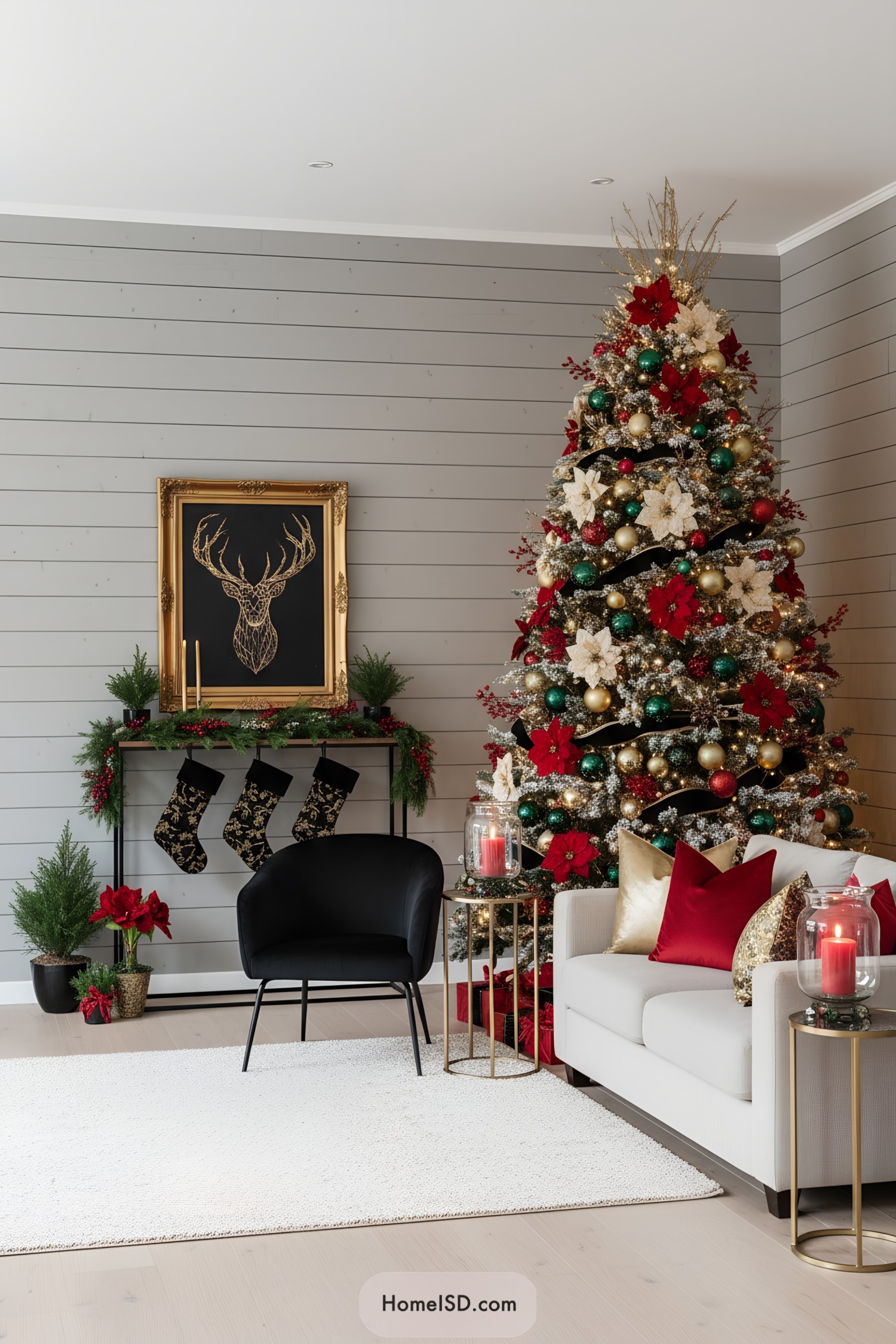 Red-and-gold Christmas tree with emerald ornaments, poinsettias, and ribbon