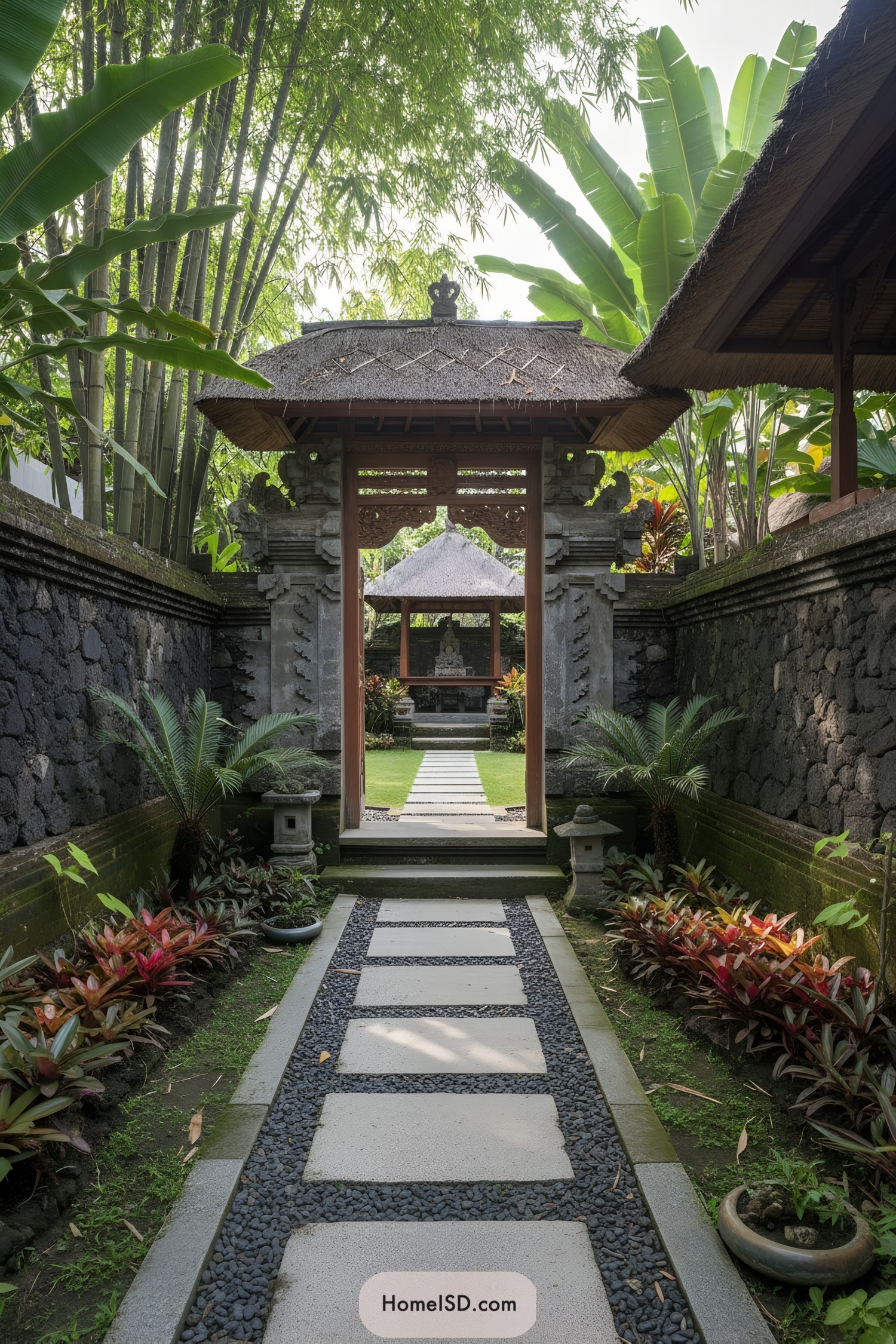 Stone path through Balinese gate to pavilion