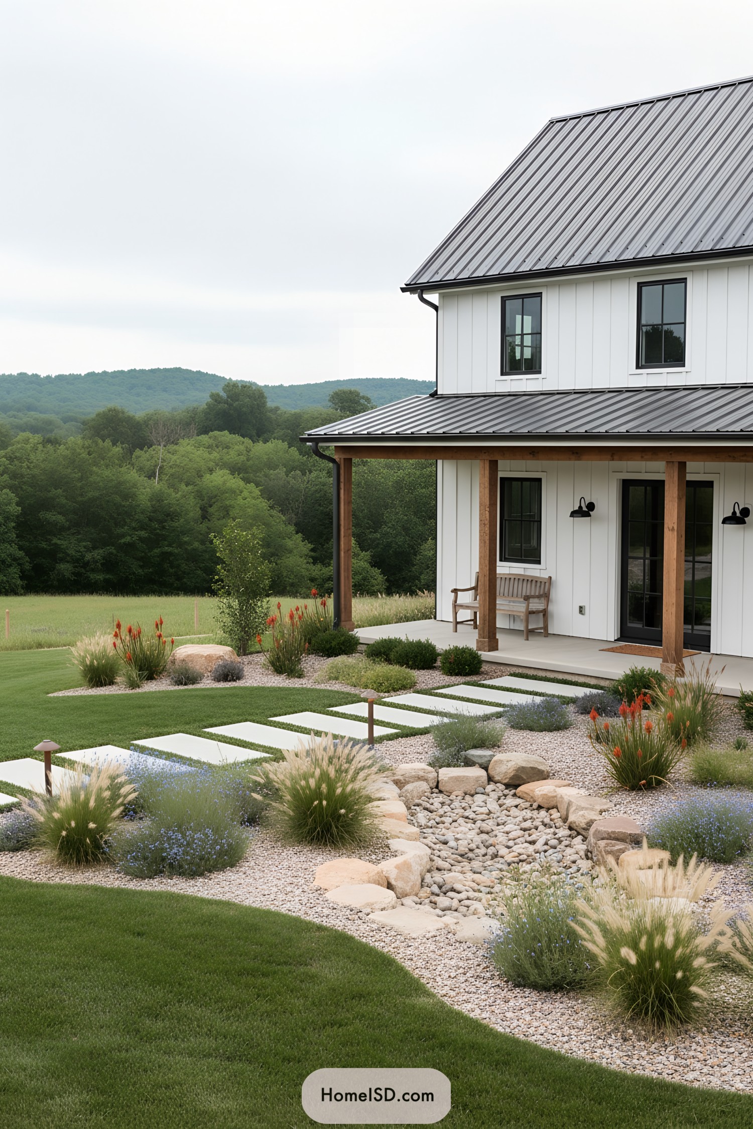Modern farmhouse with dry creek bed plantings and stepping stone path in front yard