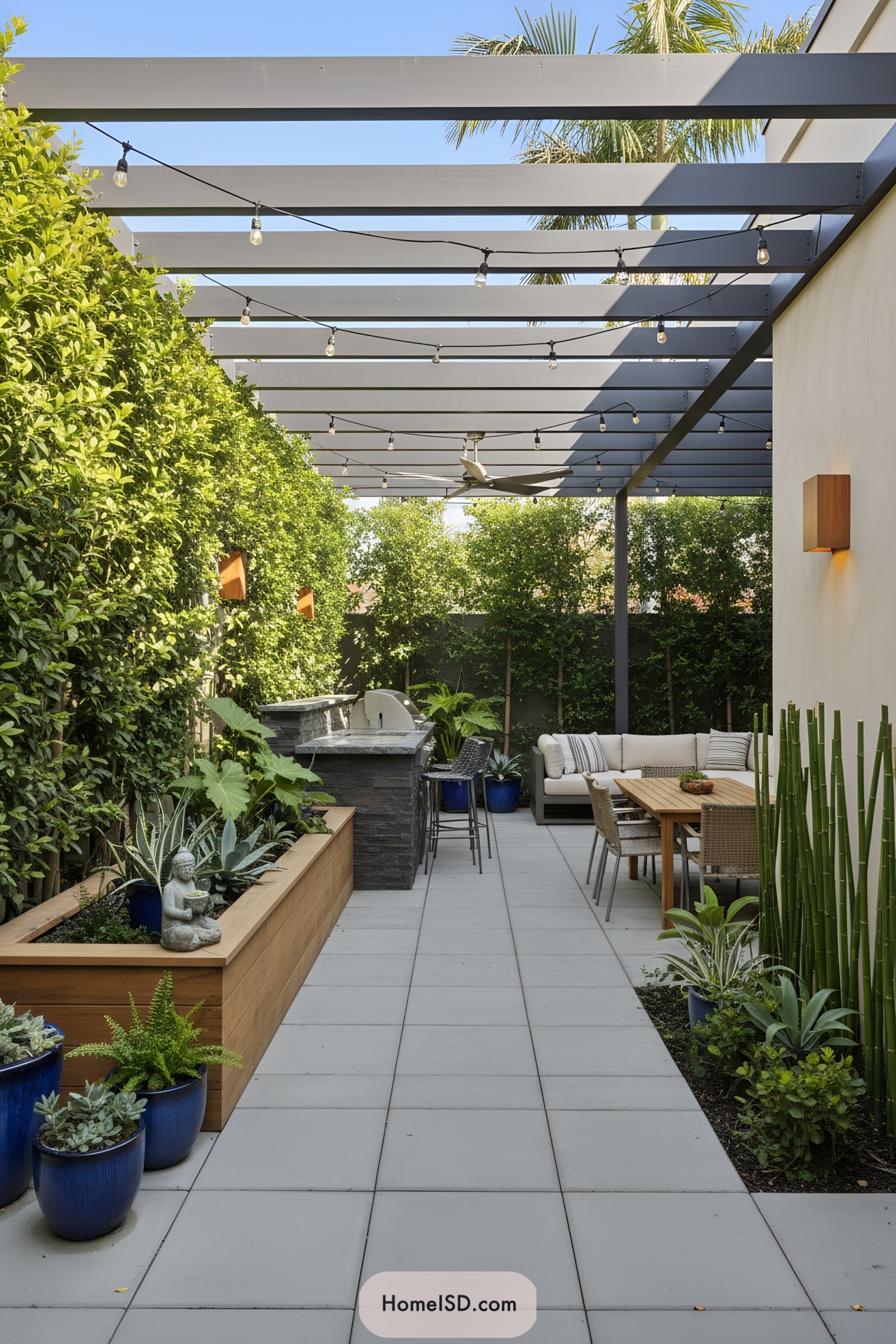 Narrow modern patio with pergola and lush plants