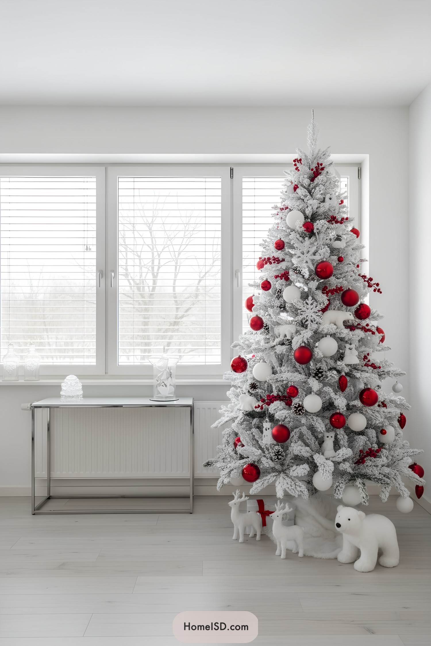 White Christmas tree with red and white ornaments and plush polar animals