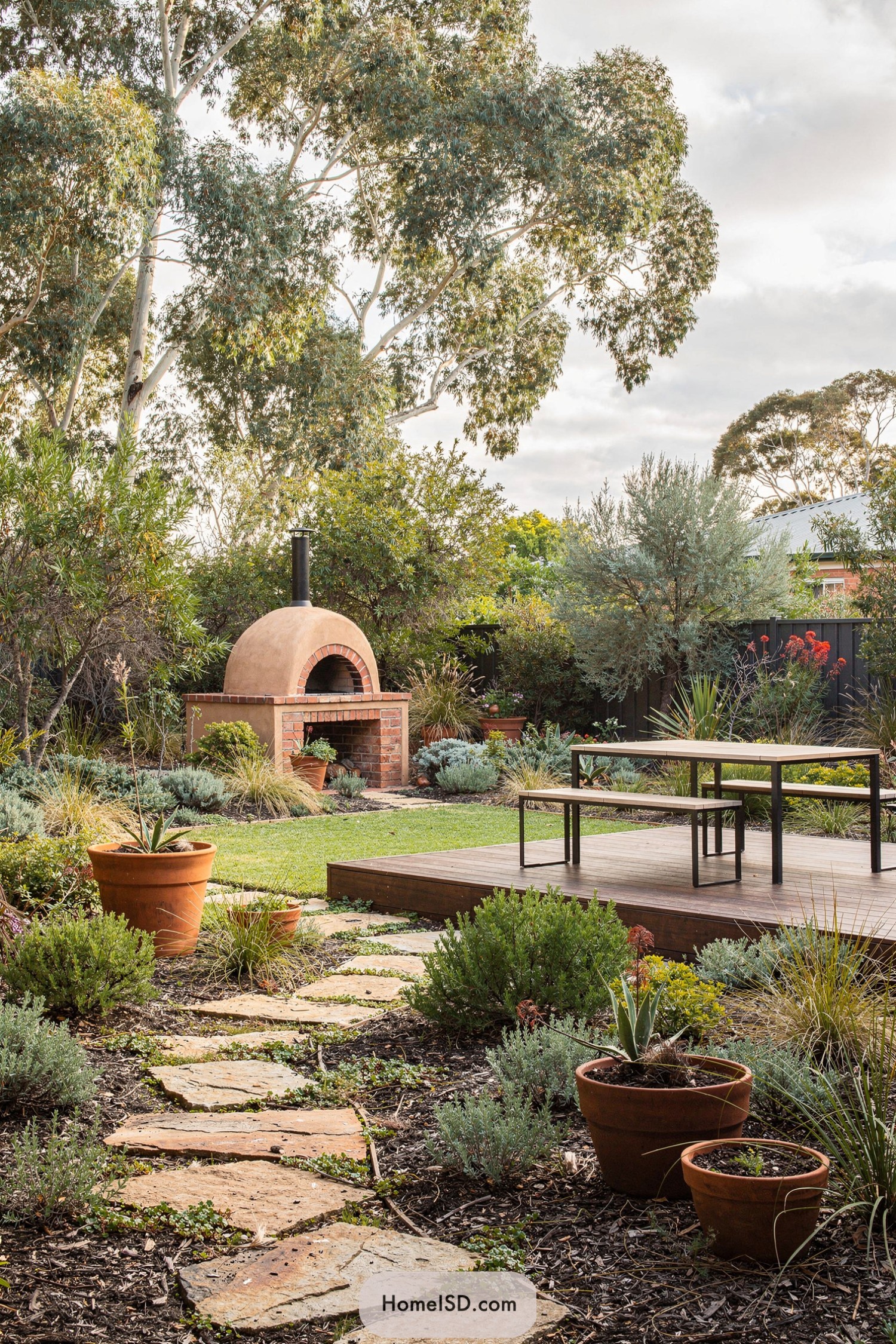 Backyard with wood-fired oven and timber deck