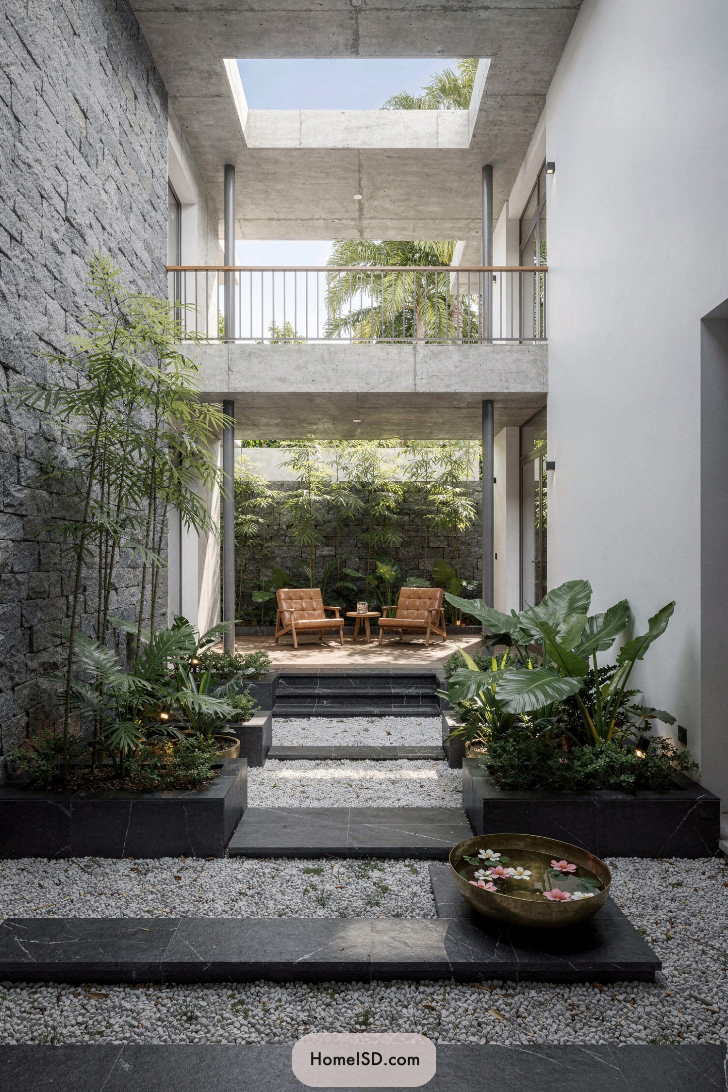 Concrete atrium courtyard with plants and chairs