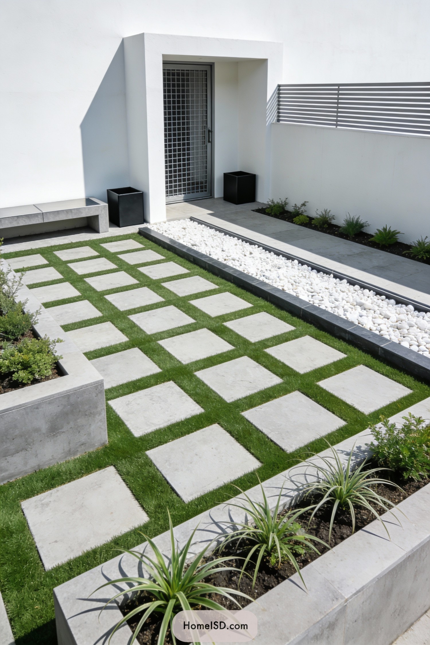 Minimalist front yard with square pavers and white rock border
