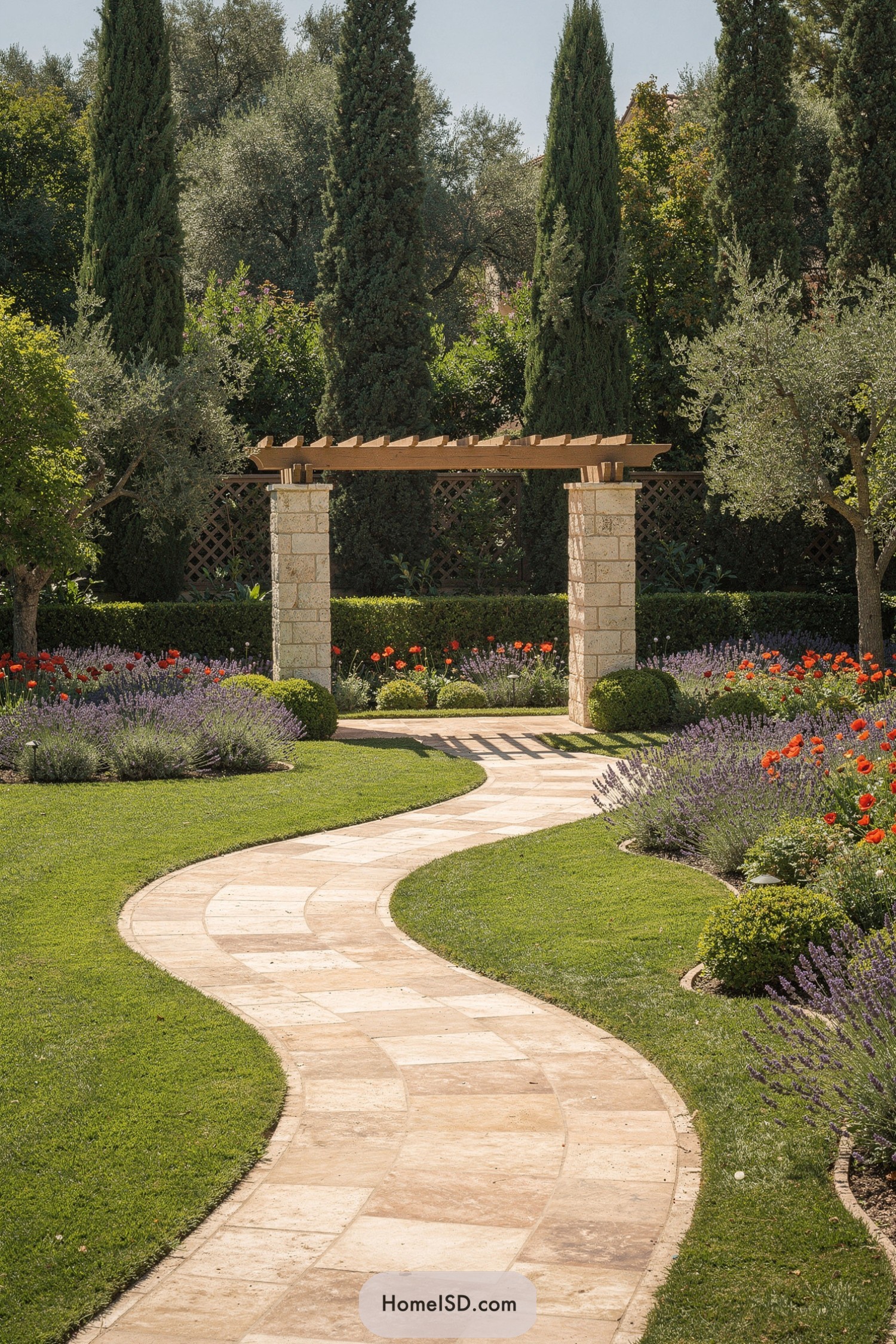 Curved stone garden path leading to pergola framed by tall cypress trees and colorful Mediterranean plantings