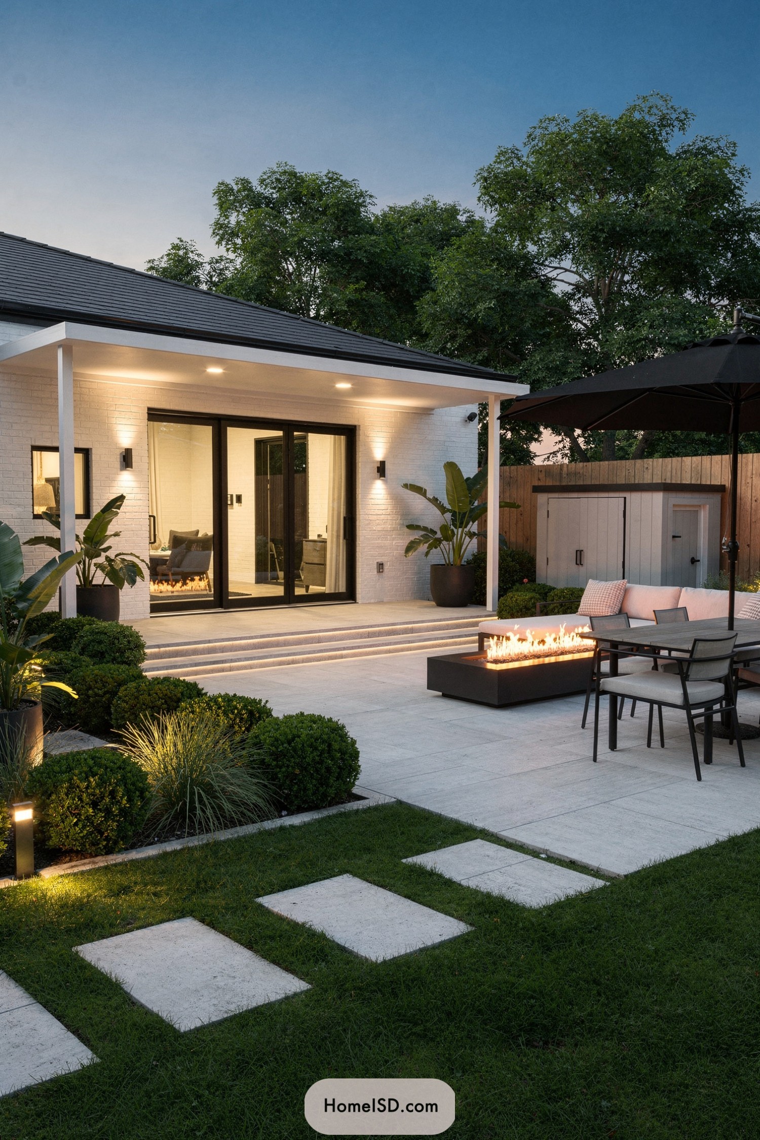 Modern backyard patio with linear fire pit