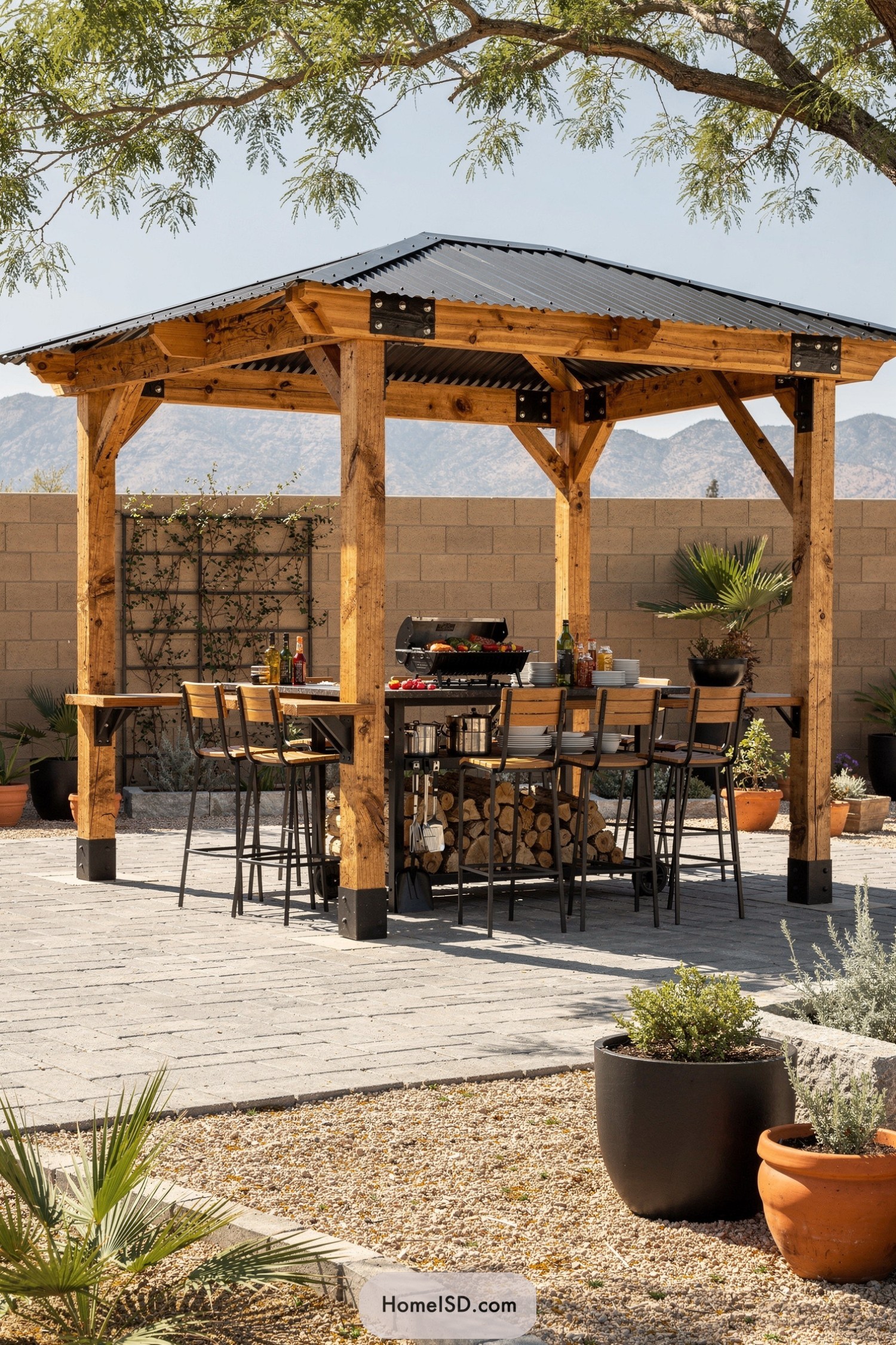 Wooden pavilion patio with bar-style grill and seating