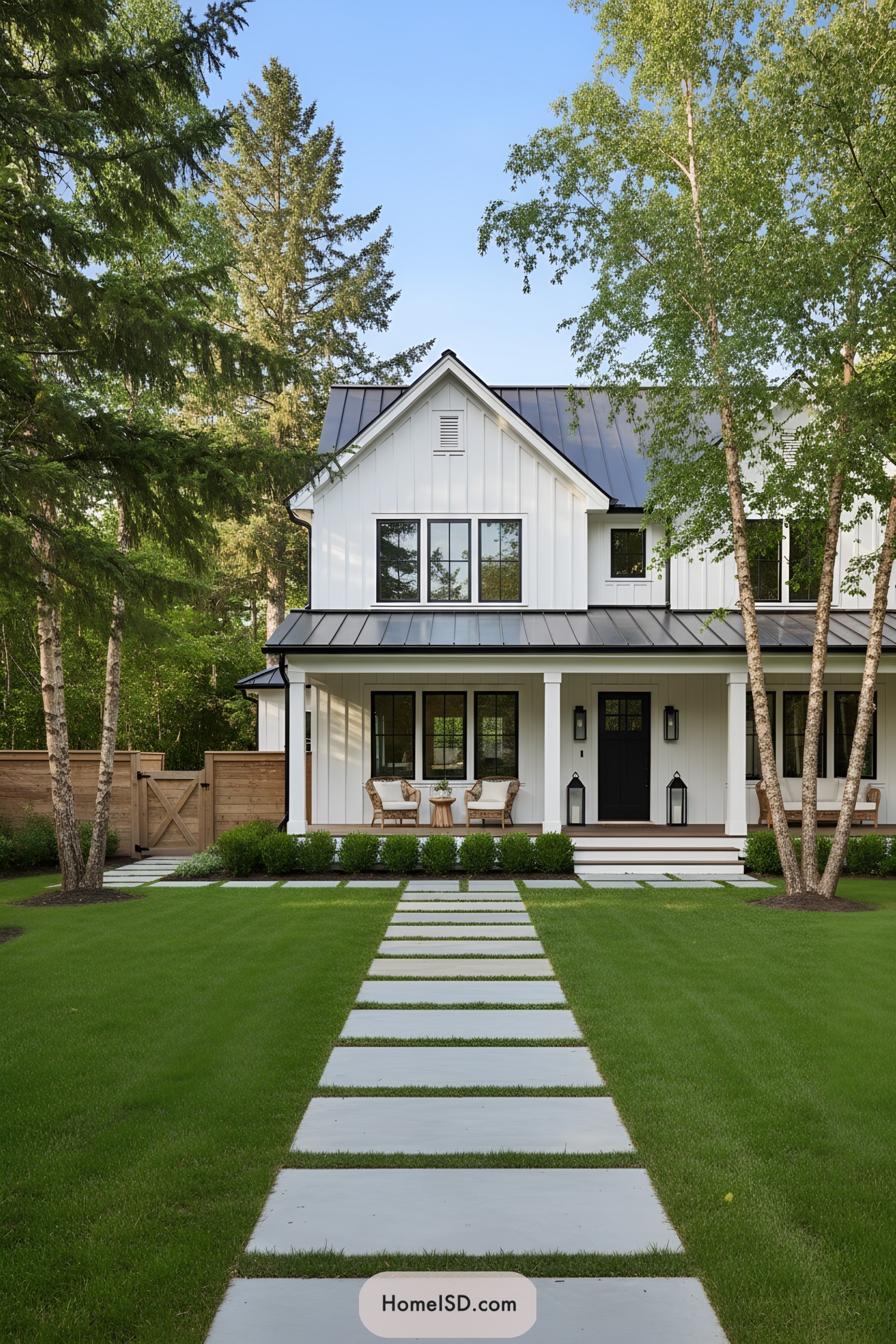 Modern farmhouse with straight paver path and lush lawn