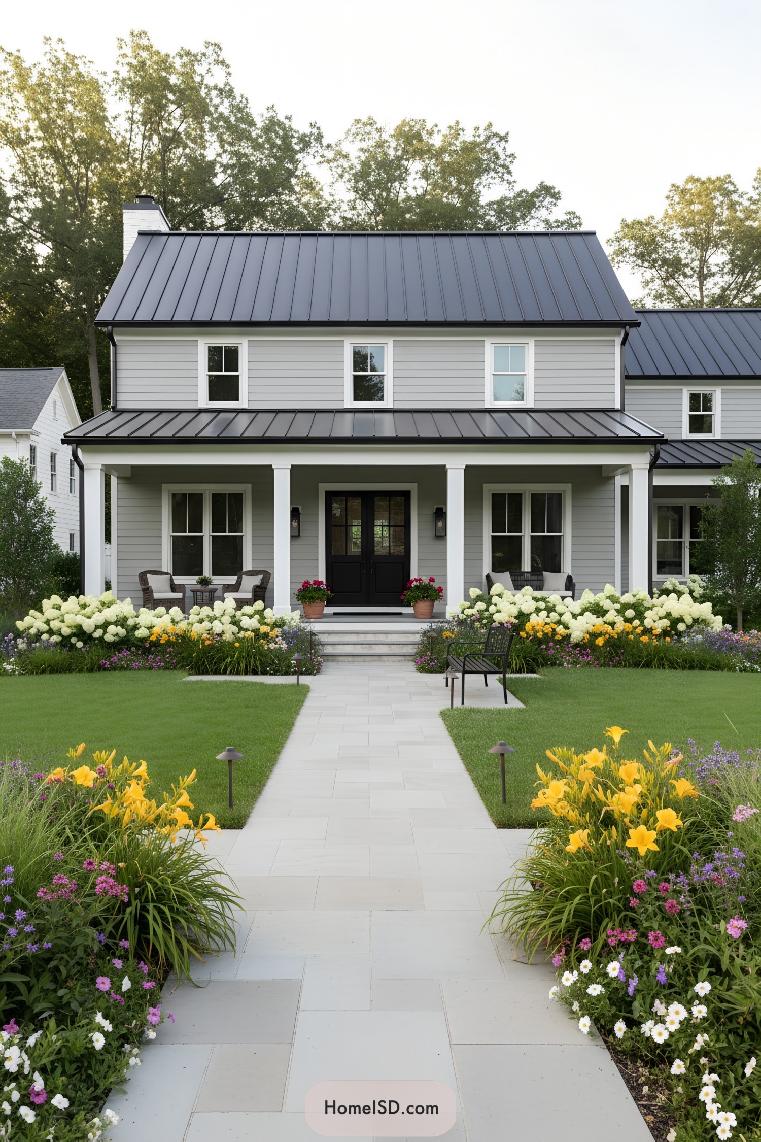 Neat farmhouse front yard with flower-lined path