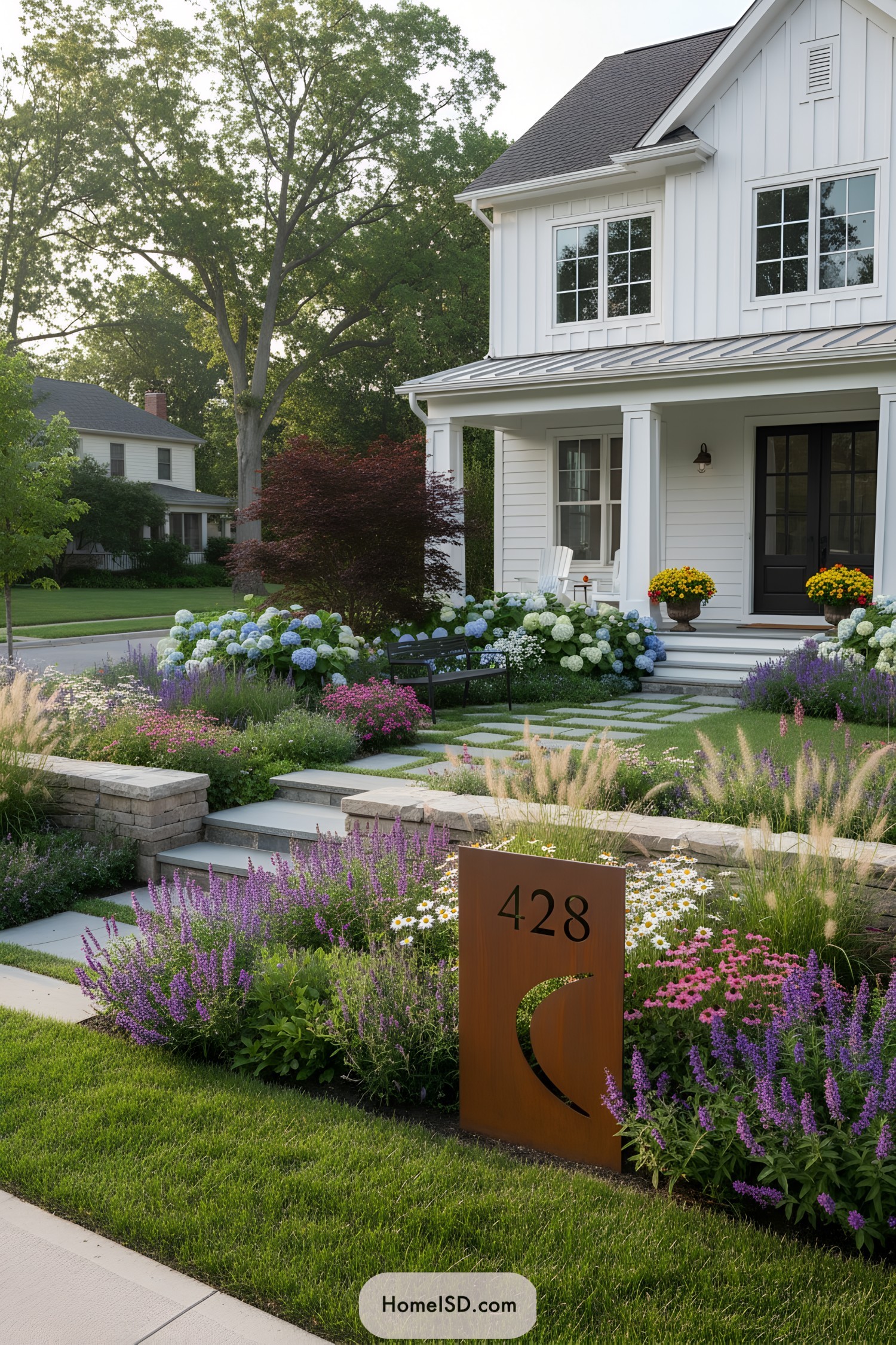 Layered farmhouse front yard with flowers and metal address sign