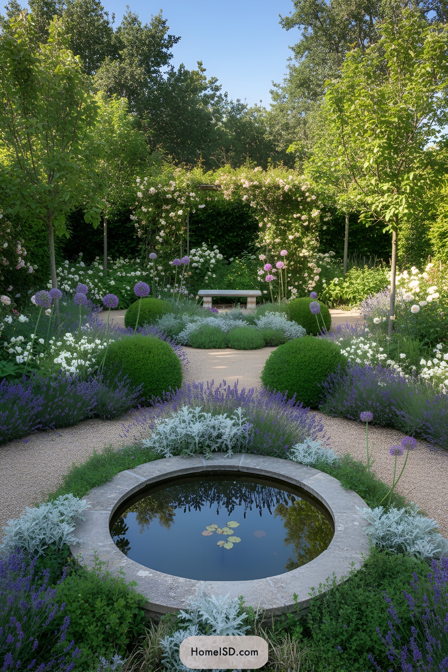 Formal circular garden with central stone pond and lavender borders