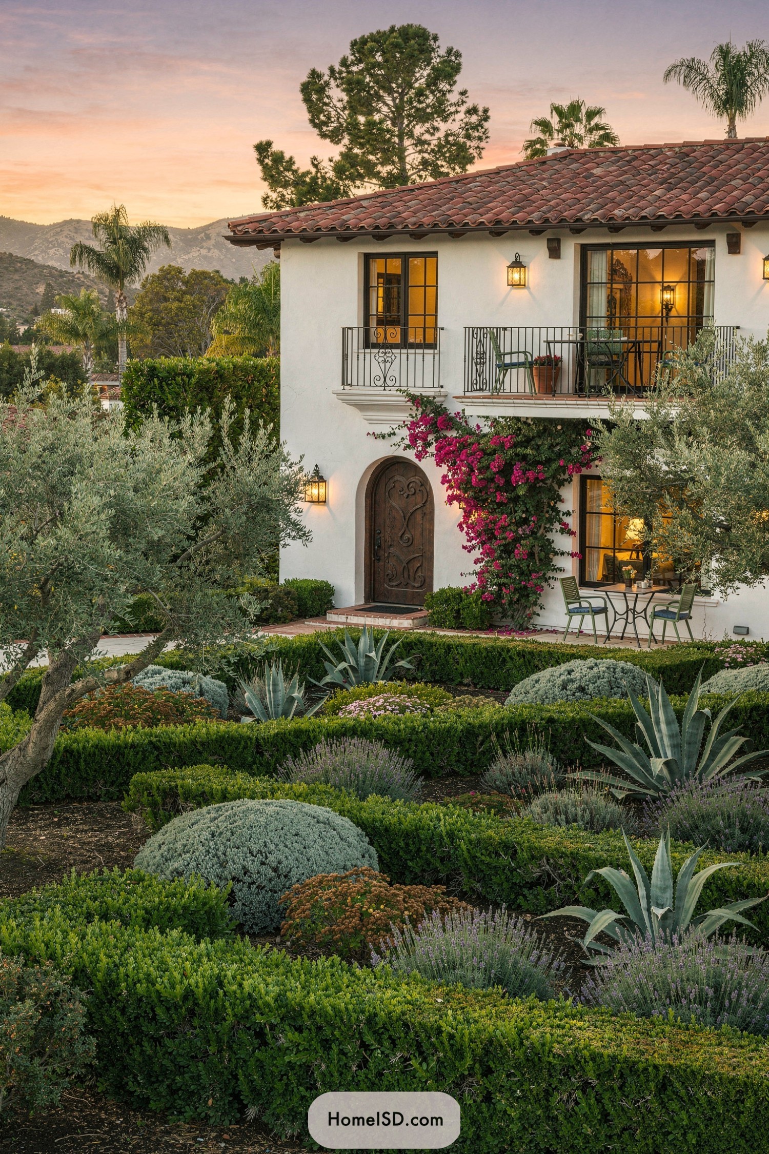 Spanish-style home with structured drought-tolerant garden