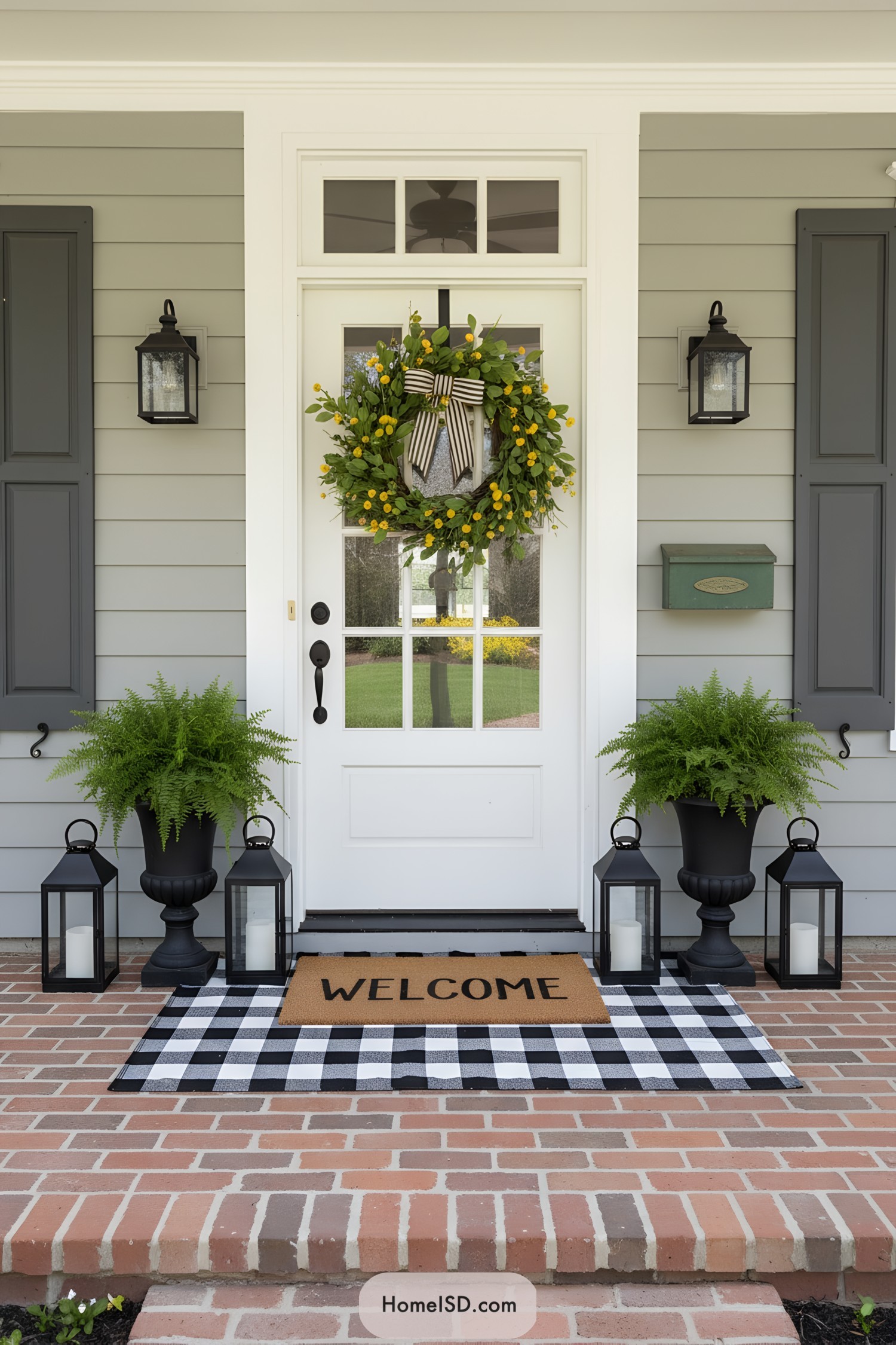 Spring porch with lemon wreath ferns and lanterns