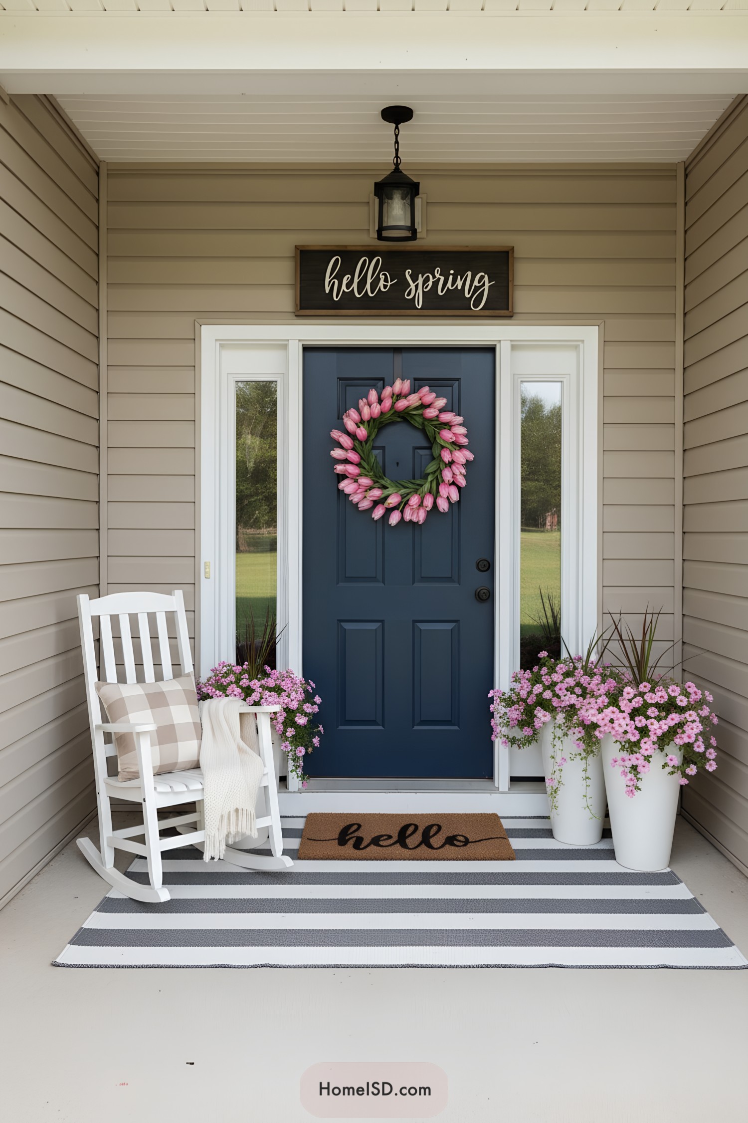 Spring porch with blue door tulip wreath and rocking chair