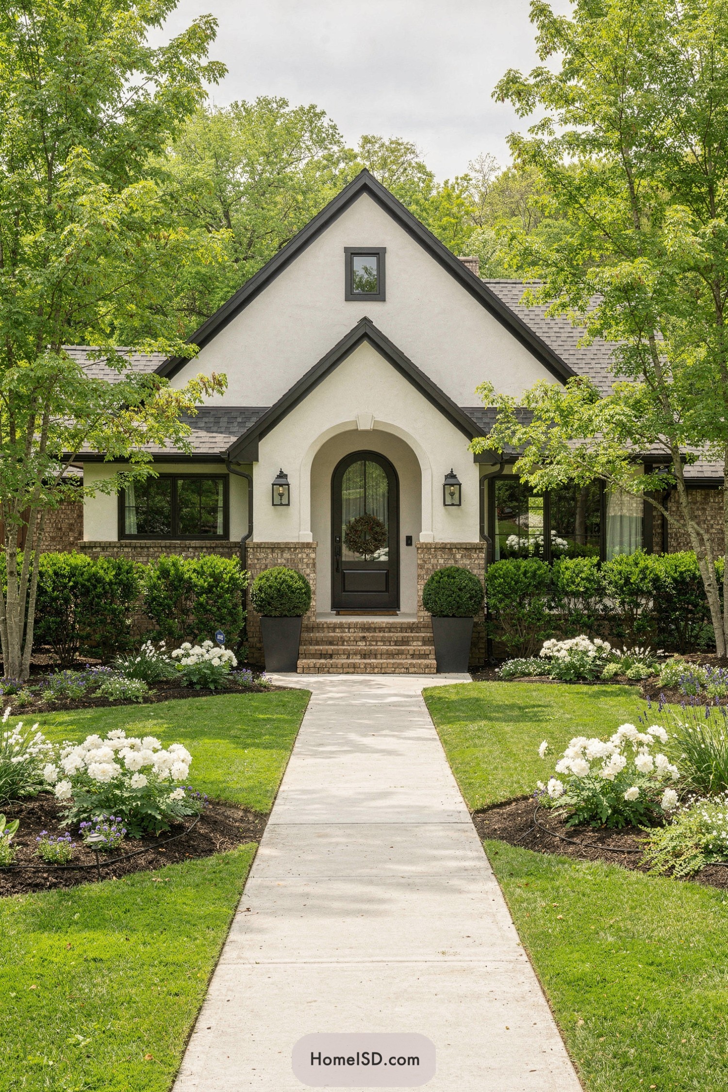 Lush symmetrical front yard with pathway