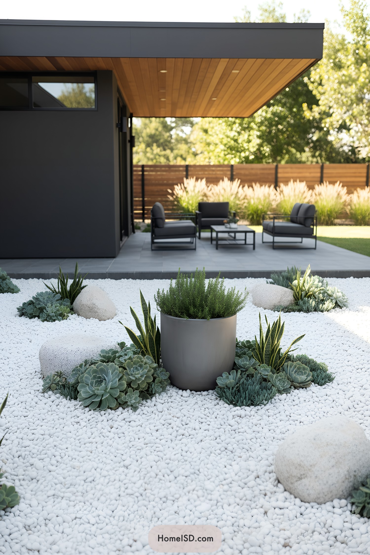 Modern patio with white pebble succulent garden